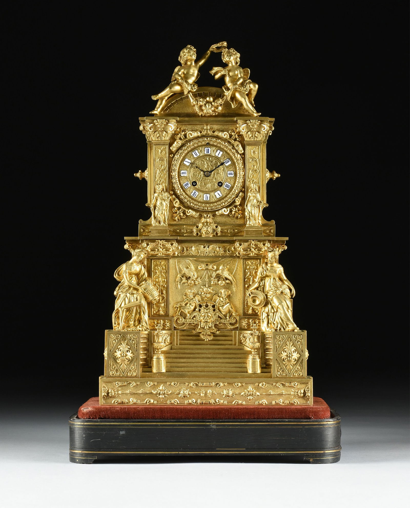 A GILT BRONZE MANTEL CLOCK, FRENCH, 19TH CENTURY, with blue and white enamel number plates, and (1 of 12)