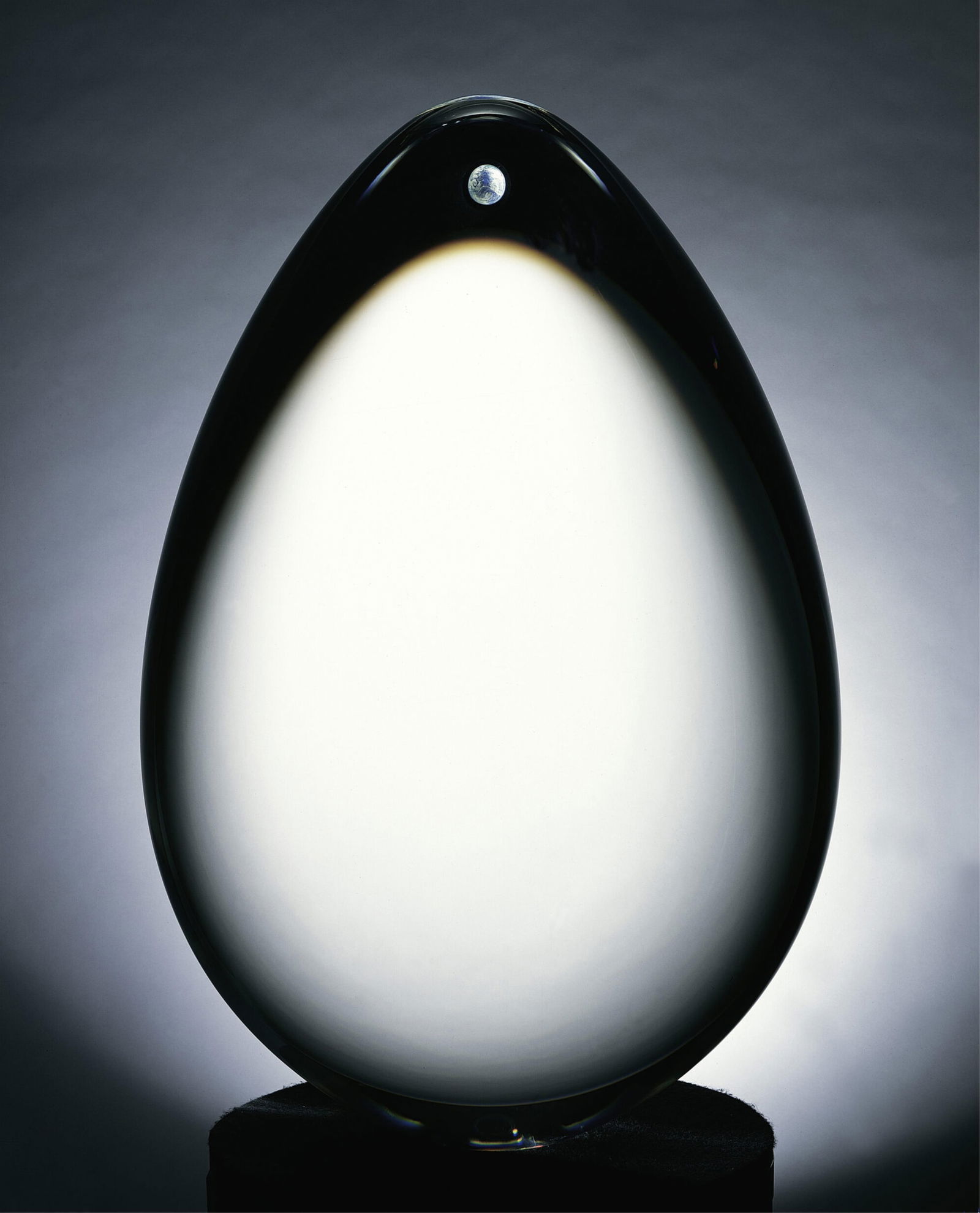 CHRISTOPHER RIES (American b. 1952) "Life," 21ST CENTURY, cut, ground, and polished optic crystal: CHRISTOPHER RIES (American b. 1952) "Life," 21ST CENTURY, cut, ground, and polished optic crystal sculpture with a polychrome engraving of the earth and a painted metal display pedestal. Sculpture hei