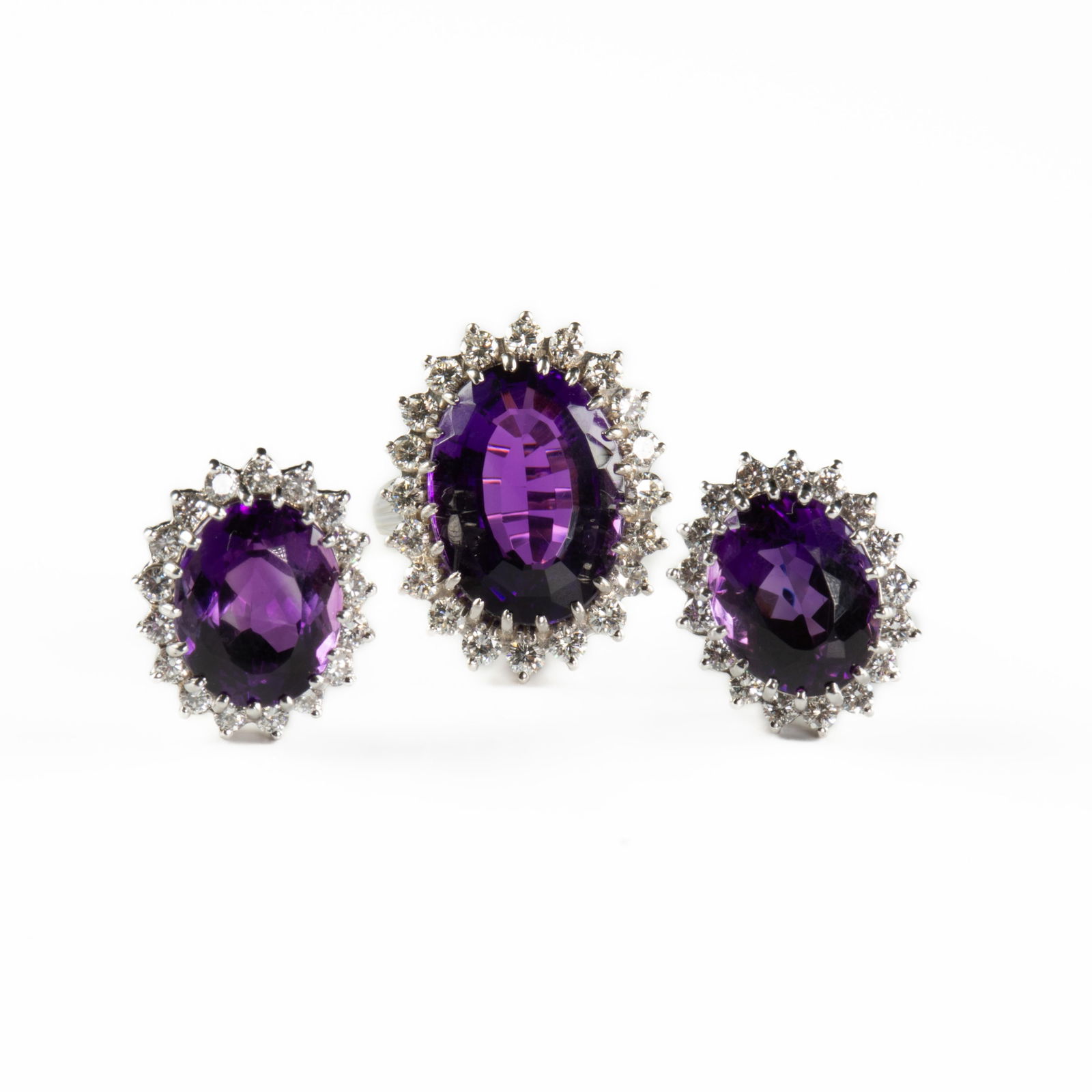 A 14K WHITE GOLD, AMETHYST, AND DIAMOND RING WITH MATCHING EARRINGS, 1983, a 14K white gold cocktail (1 of 7)
