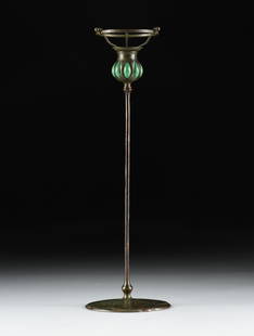 A TIFFANY STUDIOS CANDLESTICK AND SHADE HOLDER, AMERICAN, EARLY 20TH CENTURY,: A TIFFANY STUDIOS CANDLESTICK AND SHADE HOLDER, AMERICAN, EARLY 20TH CENTURY, a patinated bronze and blown out glass candlestick, marked on base, "TIFFANY STUDIOS NEW YORK / S752 / 1300;" together wit
