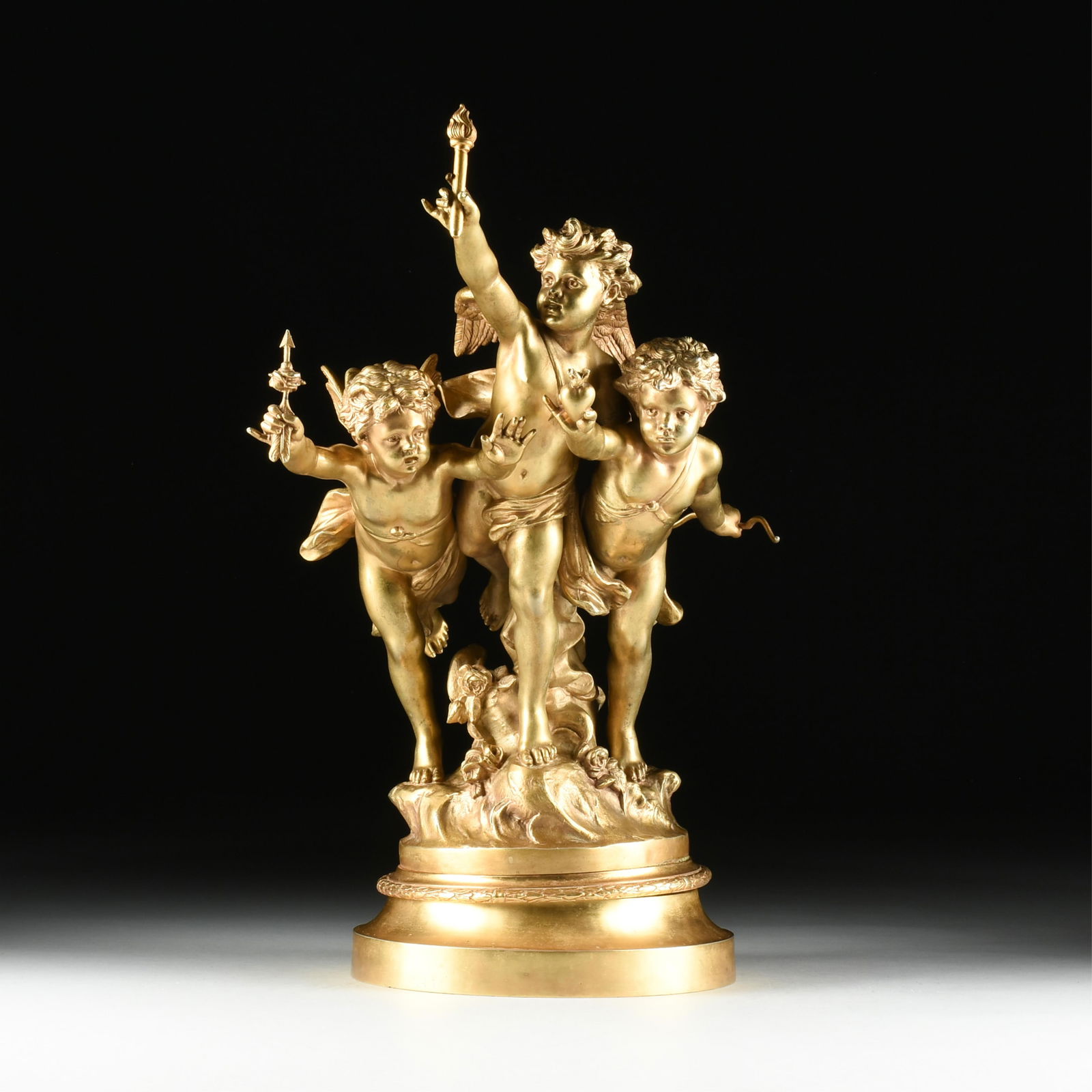 JEAN-LOUIS GRÉGOIRE (French 1840-1890) “Love’s Victory," LATE 19TH CENTURY,: JEAN-LOUIS GRÉGOIRE (French 1840-1890) “Love’s Victory," LATE 19TH CENTURY, gilt and silvered bronze sculpture of three putti on a rotating base with a title plaque and signed on back