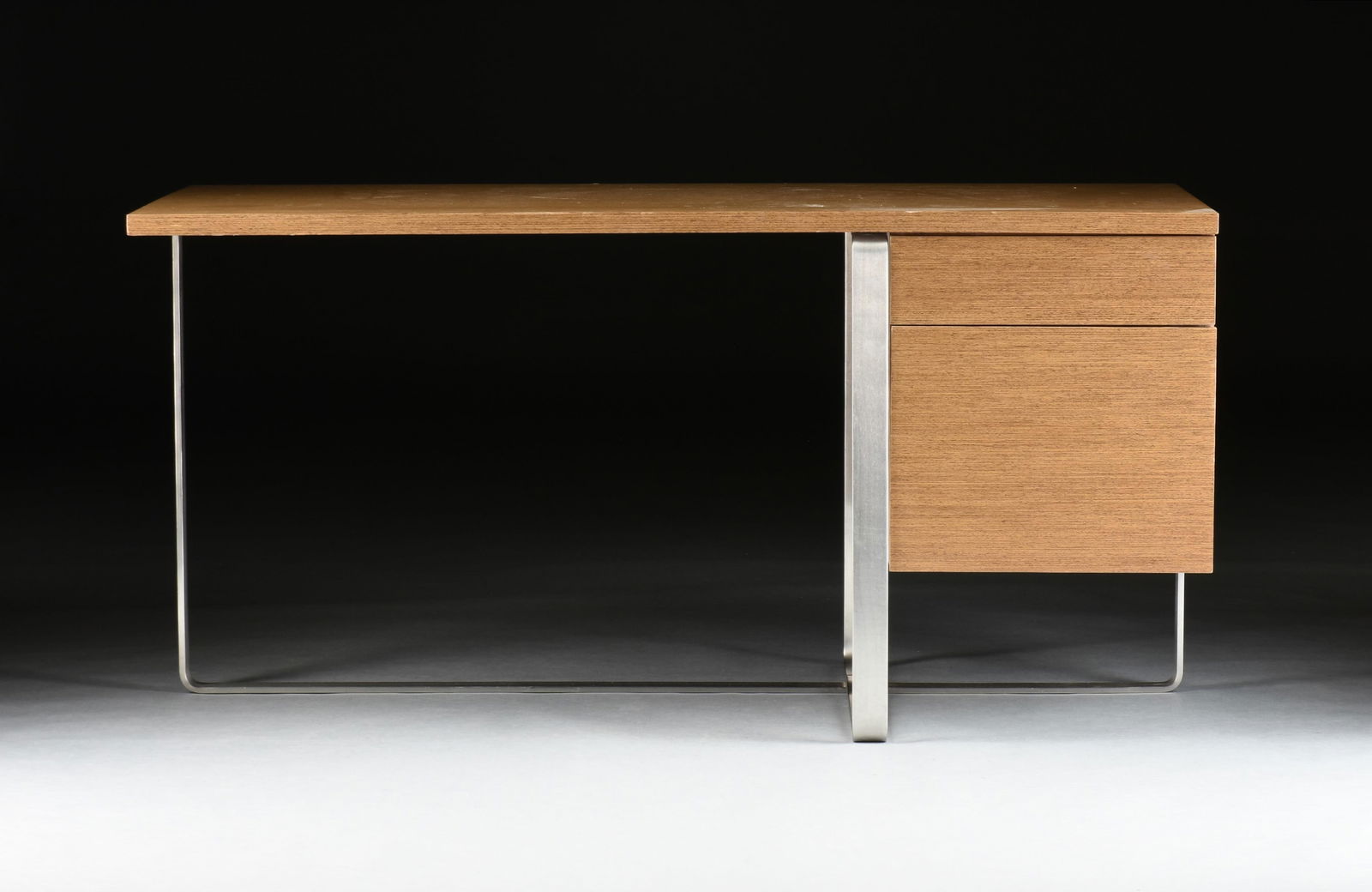 A DESIGN WITHIN REACH "Liege Desk," 21ST CENTURY,: A DESIGN WITHIN REACH "Liege Desk," 21ST CENTURY, a midcentury modern style veneered desk with two drawers and a steel base designed by Jeffrey Bernett and Nicholas Dodziuk. 29 3/4 x 60 x 30 in. (75.6