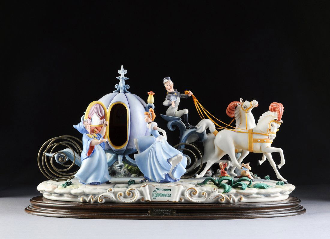 A LIMITED EDITION LAURENZ CAPODIMONTE PORCELAIN FI: A LIMITED EDITION LAURENZ CAPODIMONTE PORCELAIN FIGURAL GROUP OF DISNEY'S CINDERELLA'S HORSE-DRAWN COACH, CIRCA 1984, NUMBERED 65/2500. Cinderella's horse-drawn coach awaits her, courtesy of her Fairy