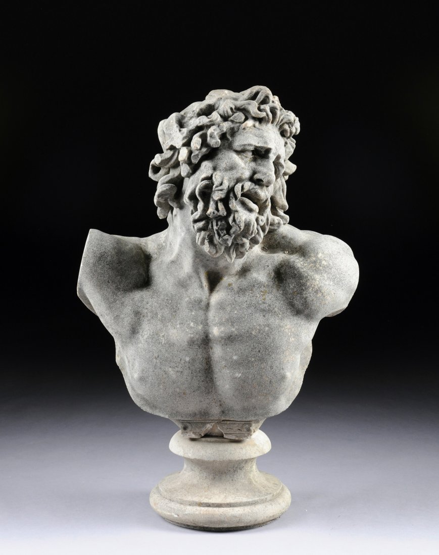 A GARDEN STATUARY CAST STONE BUST OF LAOCOON, POS: A GARDEN STATUARY CAST STONE BUST OF LAOCOON, POSSIBLY ITALIAN, 20TH CENTURY, the dramatically detailed anguished expression beneath thick curly hair and bearded face above a bare partial torso with t