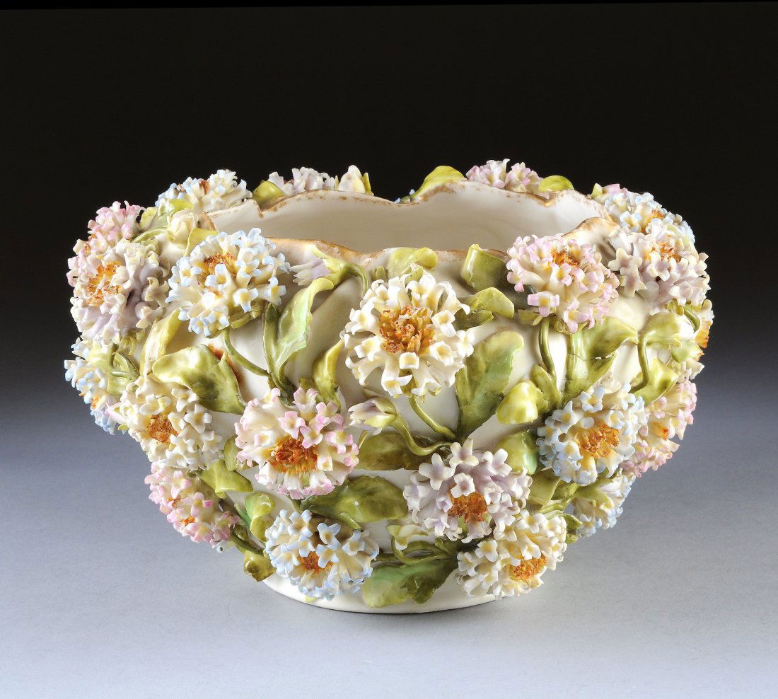 A PLAUE, GERMANY, DELICATELY MODELED ANEMONE FLOW: A PLAUE, GERMANY, DELICATELY MODELED ANEMONE FLOWER ENCRUSTED CENTERPIECE BOWL, BY C.G.SCHIERHOLZ, UNDERGLAZED BLUE DOUBLE CROSSED LINE MARK, IMPRESSED NUMBERS 3345, 75, CIRCA 1880-1906, the parcel gi