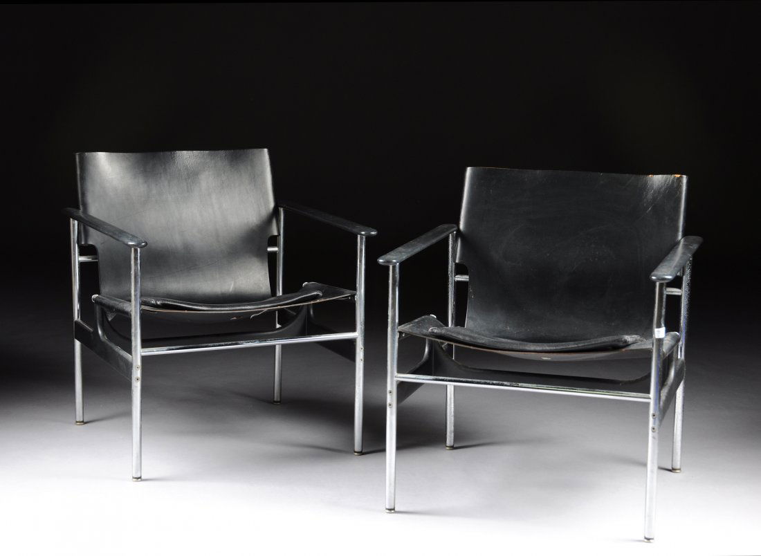 A PAIR OF KNOLL BASCULANT STYLE LOUNGE ARMCHAIRS,: A PAIR OF KNOLL BASCULANT STYLE LOUNGE ARMCHAIRS, ORIGINAL DESIGN BY JEANNERET, PERRIAND AND LE CORBUSIER, KNOLL INTERNATIONAL, THIRD-QUARTER 20TH CENTURY, each with a rectangular one piece black leat