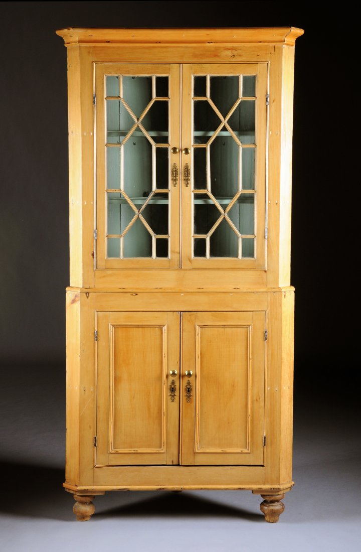 A FEDERAL PINE CORNER CUPBOARD, NEW ENGLAND, CIRC: A FEDERAL PINE CORNER CUPBOARD, NEW ENGLAND, CIRCA 1790-1810, the upper section with molded cornice, two paneled glazed doors opening to three painted serpentine shelves, above two cupboard doors reve