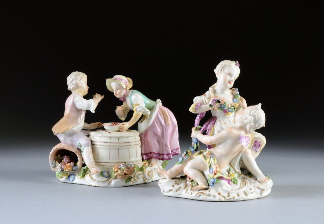 TWO MEISSEN EMBLEMATIC FIGURAL GROUPS, BLUE CROSS: TWO MEISSEN EMBLEMATIC FIGURAL GROUPS, BLUE CROSSED SWORDS MARK, ONE WITH PRESSENUMMER 26, THE OTHER INCISED 17, each painted in traditional Meissen colors, one modeled as a young girl and Cupid with