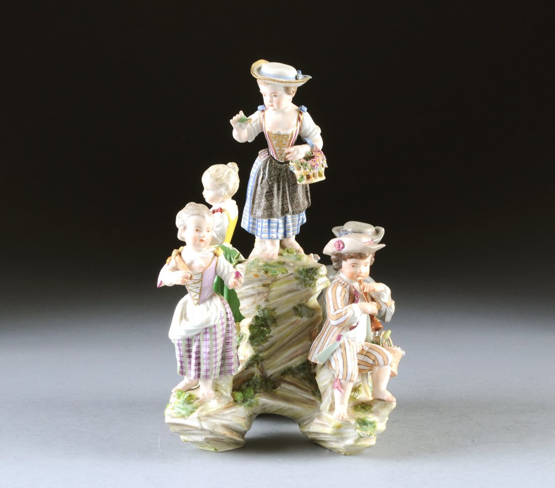 A MEISSEN POLYCHROME ENAMELED FIGURAL GROUP CENTE: A MEISSEN POLYCHROME ENAMELED FIGURAL GROUP CENTERPIECE, BLUE CROSSED SWORDS ENCLOSING AN "I" MARK, 19TH/20TH CENTURY, emblematic of the human senses with four children in 18th Century provincial styl