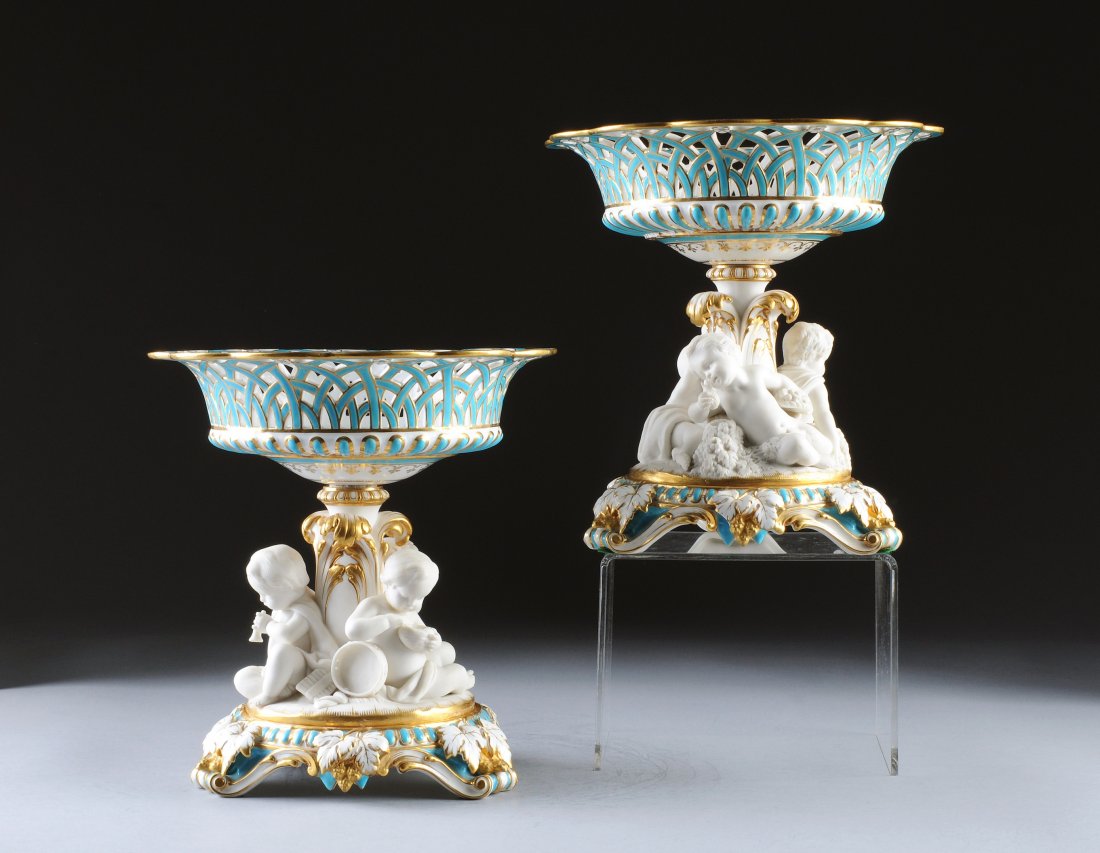 A PAIR OF MINTON TURQUOISE GROUND AND PARIAN FIGU: A PAIR OF MINTON TURQUOISE GROUND AND PARIAN FIGURAL CENTERPIECES, DATE CODED, ONE INCISED 17/2/65, ONE IMPRESSED MINTON, THIRD QUARTER 19TH CENTURY, each with a tapering circular reticulated basket f