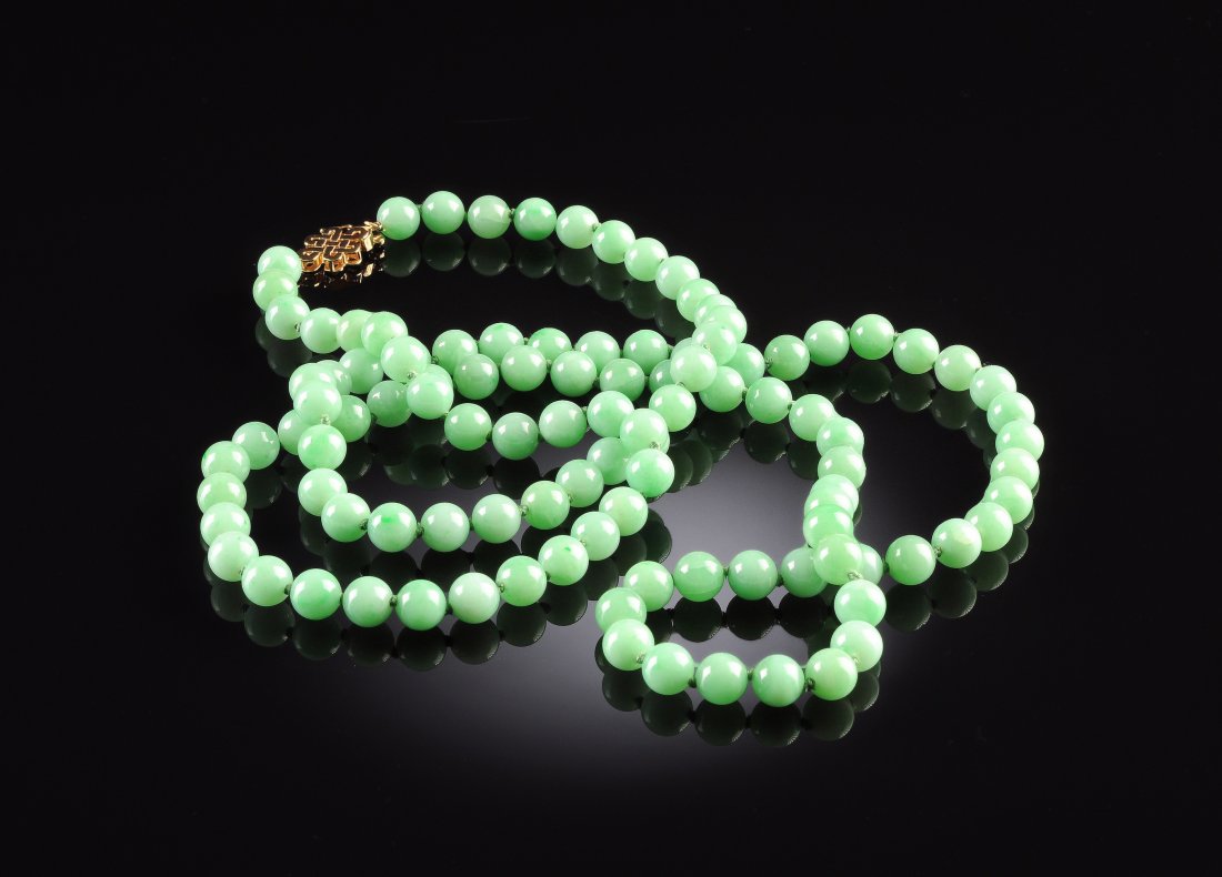A STRAND OF GREEN CHINESE "A" JADEITE JADE LADY'S: A STRAND OF GREEN CHINESE "A" JADEITE JADE LADY'S BEADS , with 14K yellow gold clasp ,45" in length, consisting of 108 natural, type "A" jadeite jade spherical beads, full drilled, measuring approxima