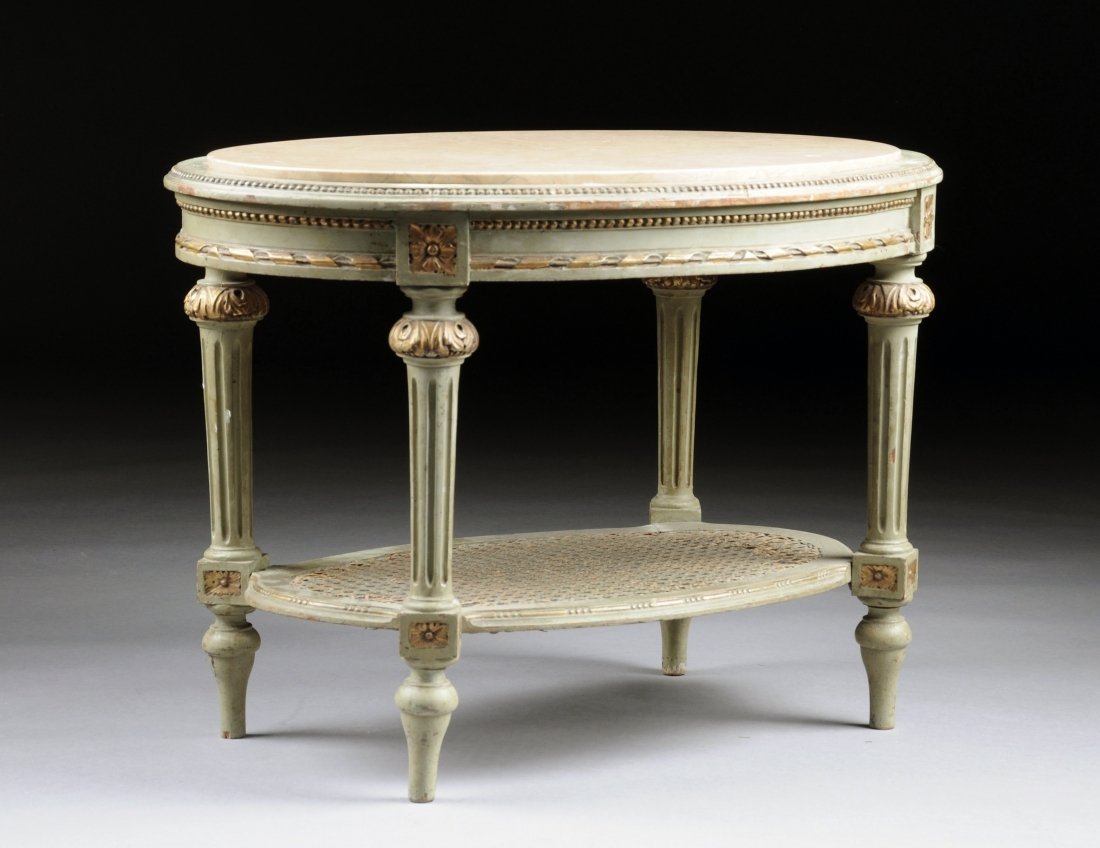 A LOUIS XVI STYLE MARBLE TOP GREEN PAINTED AND CARVED W: A LOUIS XVI STYLE MARBLE TOP GREEN PAINTED AND CARVED WOOD OCCASIONAL TABLE, EARLY 20TH CENTURY, the oval variegated peach colored marble top above a beaded ribbon and rod detailed frieze alternating 
