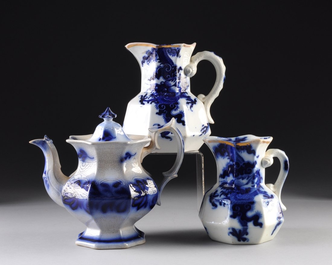 A GROUP OF THREE BLUE AND WHITE PITCHERS, ENGLISH, 19TH: A GROUP OF THREE BLUE AND WHITE PITCHERS, ENGLISH, 19TH CENTURY, comprised of two Mason's Ironstone blue and white pitchers with gilt trim to lip, height: 7 1/2" and 6 1/2"; a flow blue and white teap
