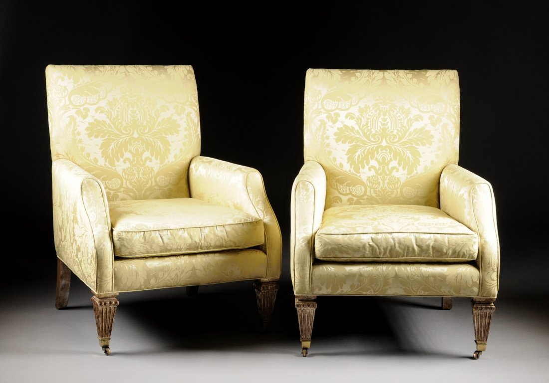 A PAIR OF BAKER YELLOW DAMASK UPHOLSTERED ARM CHAIRS, 2: A PAIR OF BAKER YELLOW DAMASK UPHOLSTERED ARM CHAIRS, 20TH CENTURY, a straight back with down filled cushions, downswept arms, raised on reeded tapering square legs ending in brass casters. Height: 39