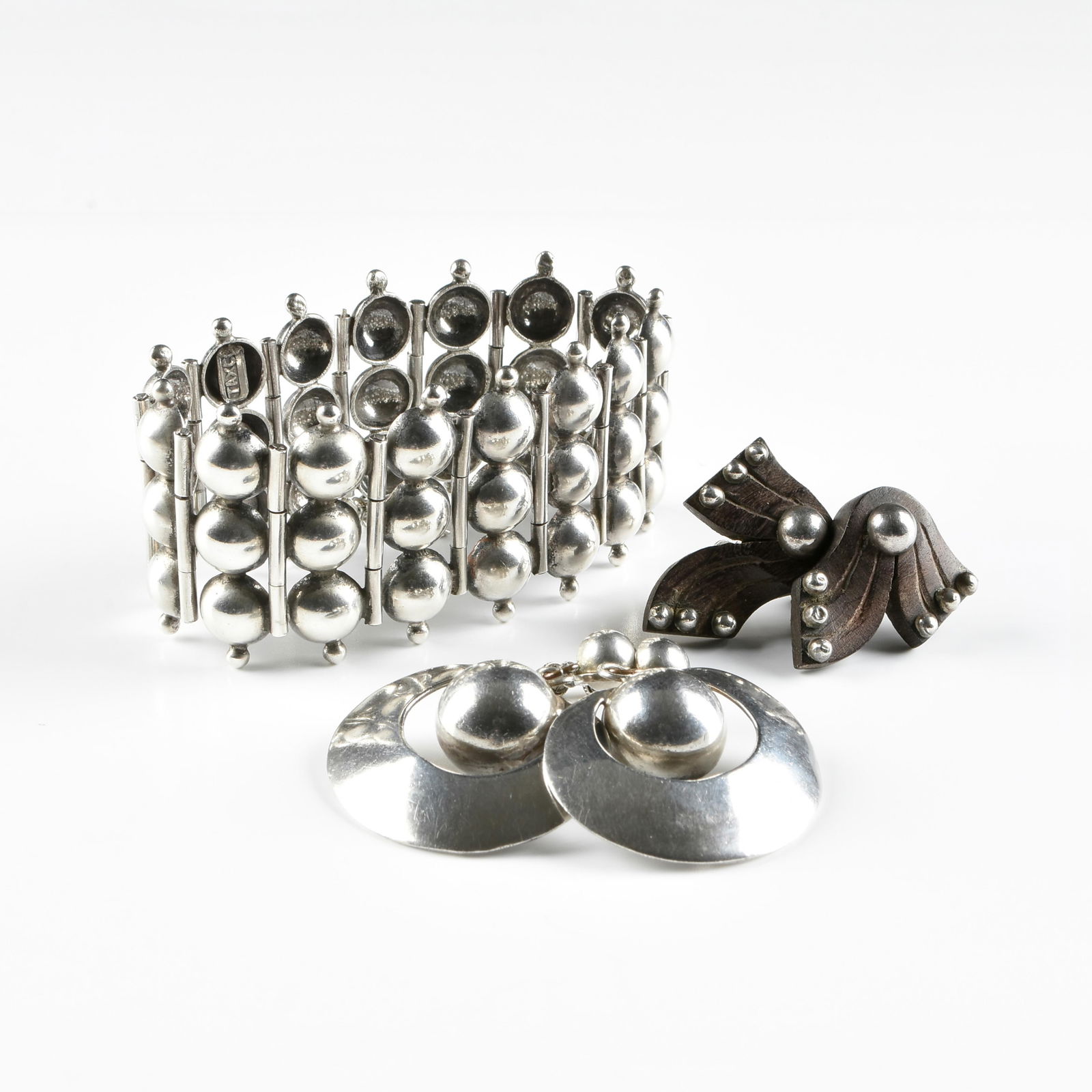 WILLIAM SPRATLING (American 1900-1967) A GROUP OF EARLY TAXCO STERLING SILVER JEWELRY, 1930s-1940s,: WILLIAM SPRATLING (American 1900-1967) A GROUP OF EARLY TAXCO STERLING SILVER JEWELRY, 1930s-1940s,three pieces of sterling silver jewelry designed by William Spratling, including a sterling silver br