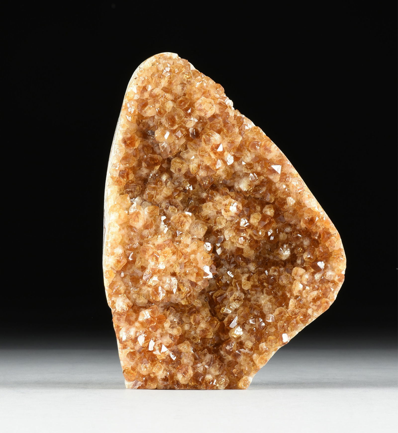 A CITRINE SPECIMEN, BRAZIL,: A CITRINE SPECIMEN, BRAZIL,polished natural citrine. Total approximate weight: 12 lbs.10.5 x 7.75 x 3.25 Provenance: Collection of Fossils and Gemstones of Houston, Texas.