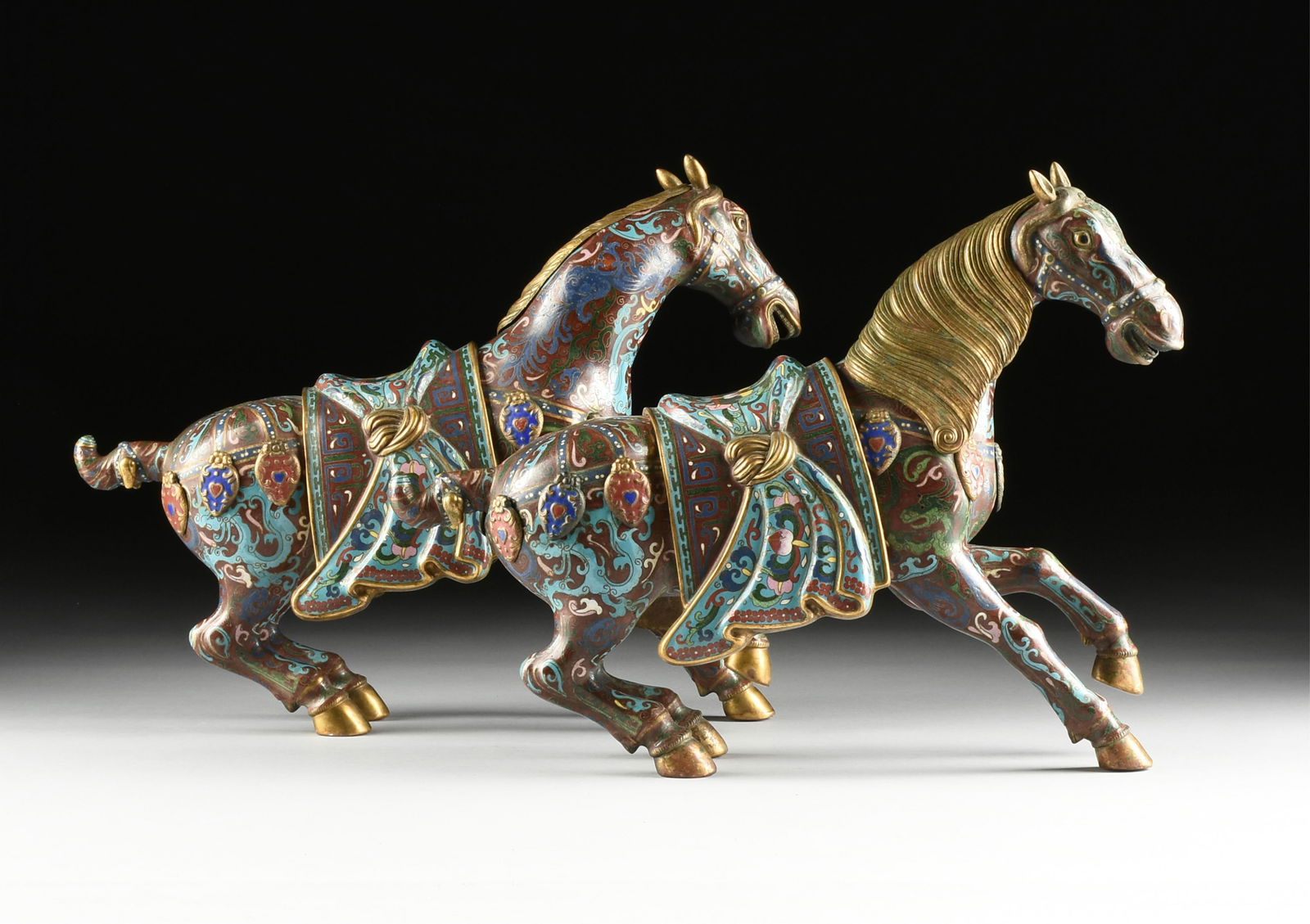 A PAIR OF CLOISSONE WAR HORSES, CHINESE, 20TH CENTURY, (1 of 10)