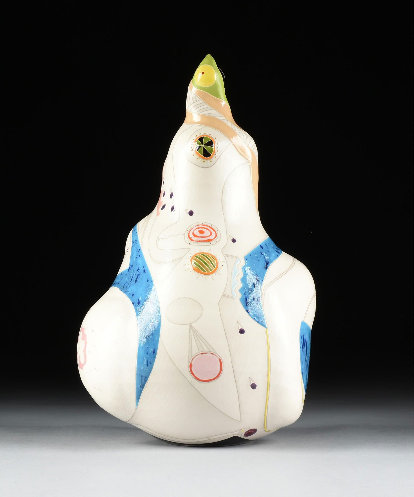 MARK KUZIO (American b. 1954) "Harlequin," LATE 20TH CENTURY,: MARK KUZIO (American b. 1954) "Harlequin," LATE 20TH CENTURY,polychrome glazed ceramic, signed at base, "Mark Kuzio / 588."18 x 10 1/2 x 9 1/2 in. (45.7 x 26.7 x 24.1 cm.)