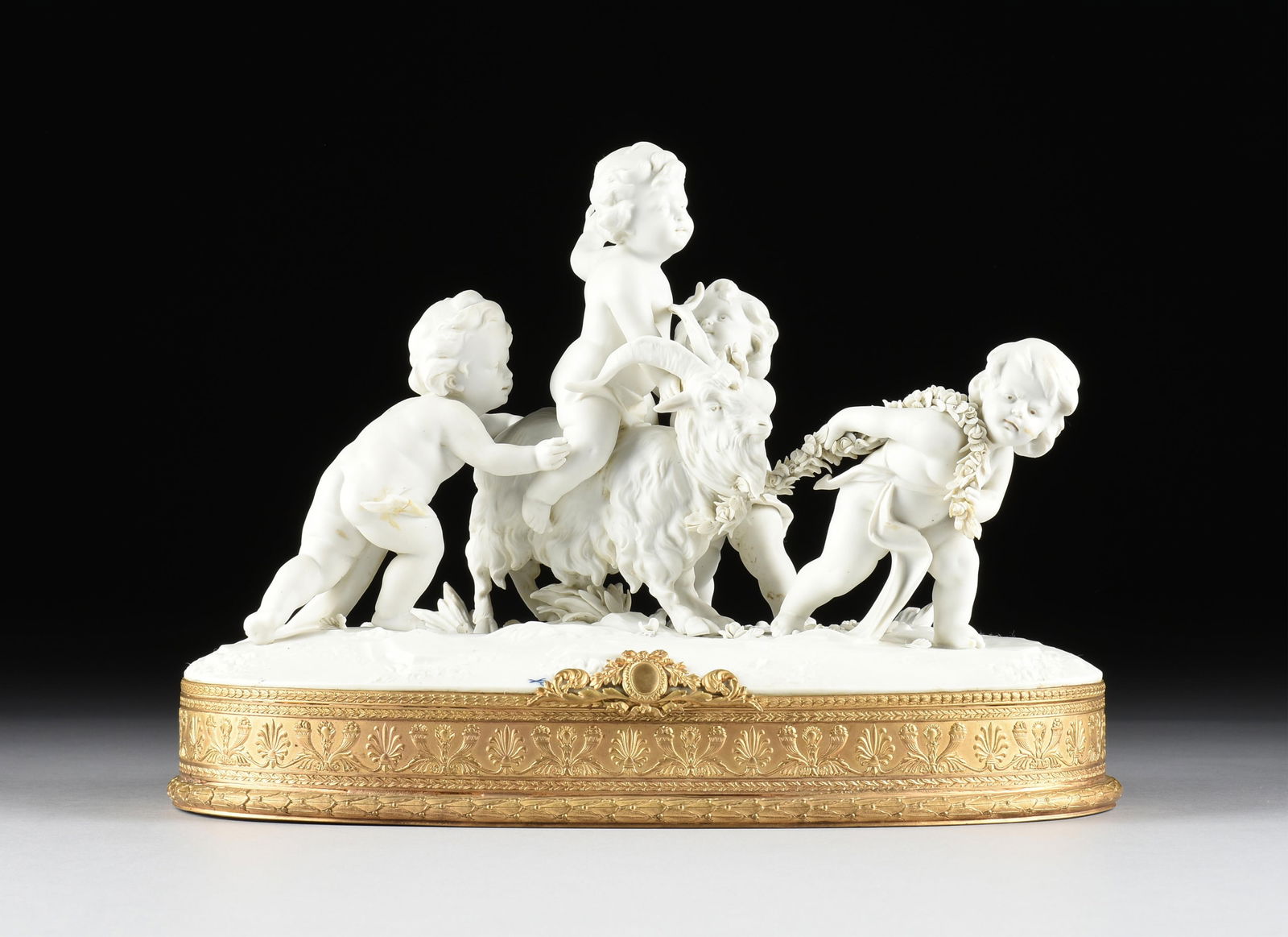 A RUDOLSTADT-VOLKSTEDT BISCUIT PORCELAIN GROUP OF PUTTI WITH A RAM, FRENCH, 19TH/20TH CENTURY,: A RUDOLSTADT-VOLKSTEDT BISCUIT PORCELAIN GROUP OF PUTTI WITH A RAM, FRENCH, 19TH/20TH CENTURY,a biscuit porcelain figural group mounted on a gilt metal base, with a spurious Meissen mark and center fr