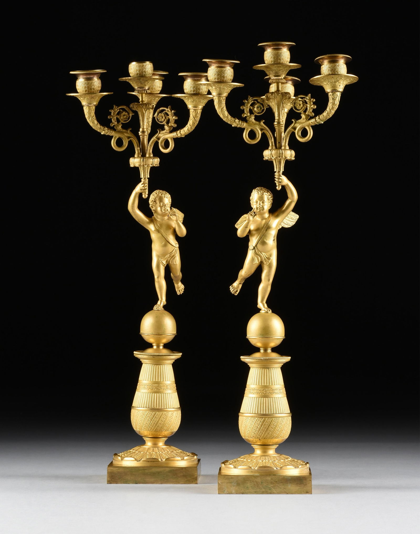 A PAIR OF REVIVAL STYLE FOUR-LIGHT PUTTI CANDELABRA, FRENCH, 19TH/20TH CENTURY, (1 of 10)