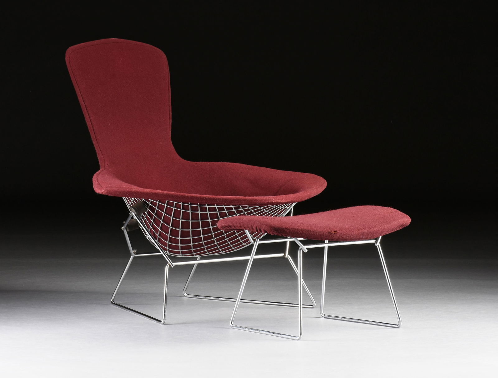 HARRY BERTOIA (Italian/American 1915-1978) A KNOLL BIRD CHAIR AND OTTOMAN, AMERICAN, MID 20TH: HARRY BERTOIA (Italian/American 1915-1978) A KNOLL BIRD CHAIR AND OTTOMAN, AMERICAN, MID 20TH CENTURY,mid-century modern steel framed chair and ottoman with vintage upholstery.Chair: 37 1/2 x 35 x 38