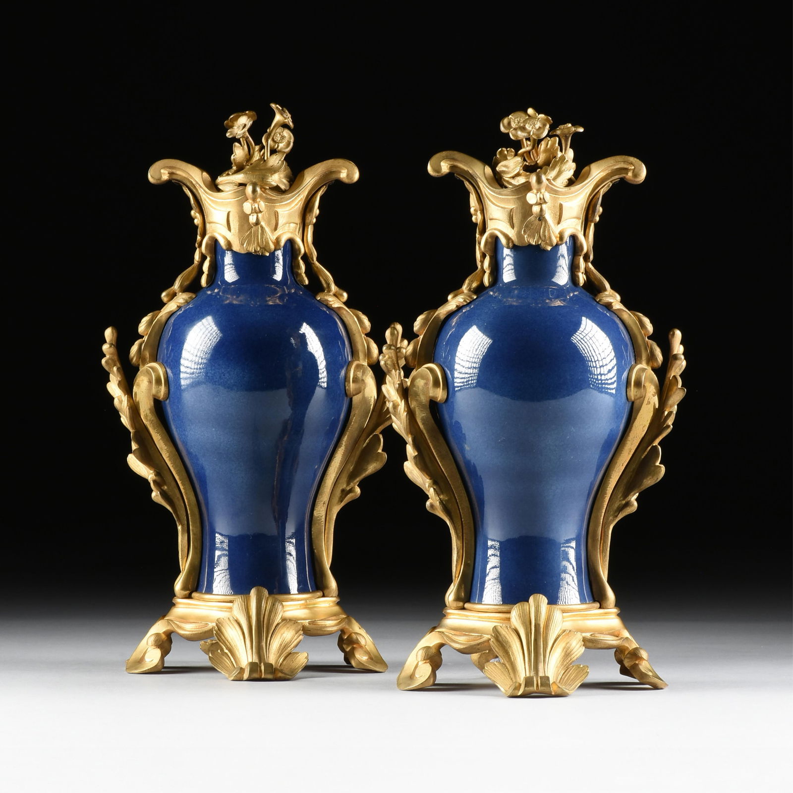PAIR OF ROCOCO STYLE BRONZE ORMOLU MOUNTED PORCELAIN VASES, CHINESE/FRENCH, 19TH CENTURY,: PAIR OF ROCOCO STYLE BRONZE ORMOLU MOUNTED PORCELAIN VASES, CHINESE/FRENCH, 19TH CENTURY,two Chinese porcelain vases with lozenge marks on each base, both with French bronze ormolu mounts and covers.E