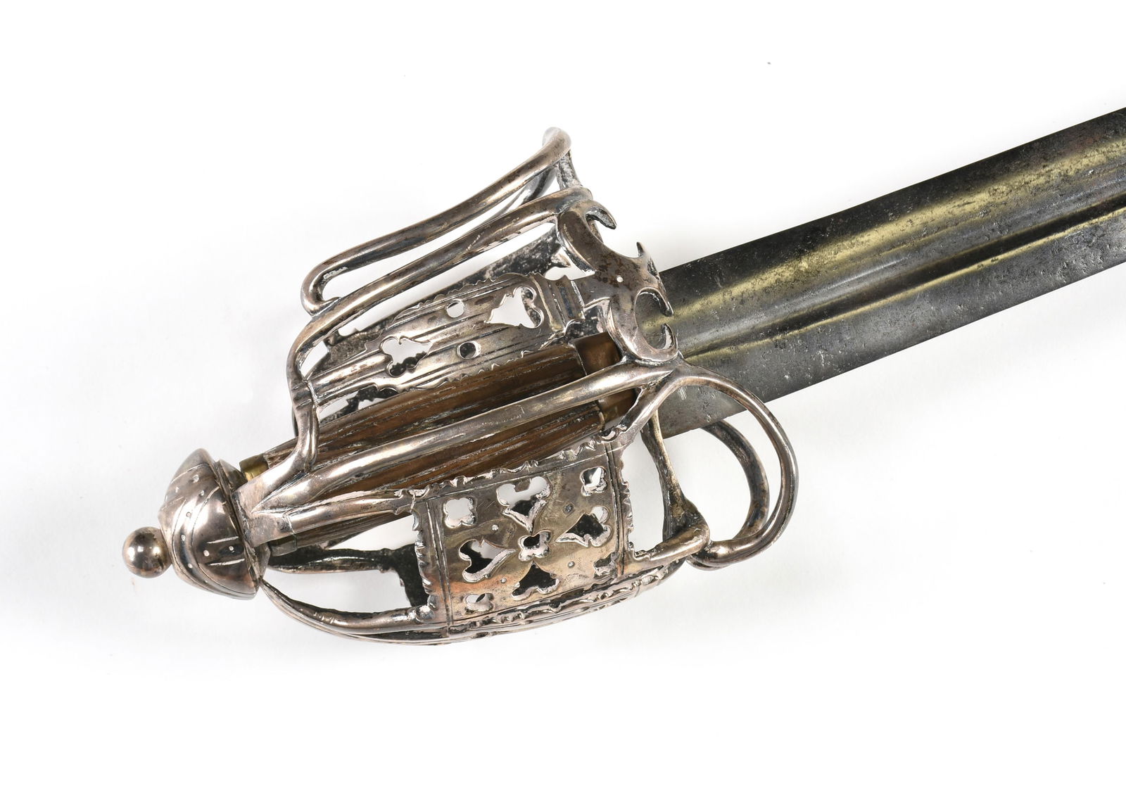 A SILVER BASKET HILTED BROADSWORD WITH HEART MOTIF, SCOTTISH, 1ST HALF 18TH CENTURY,: A SILVER BASKET HILTED BROADSWORD WITH HEART MOTIF, SCOTTISH, 1ST HALF 18TH CENTURY,a double edged blade with a small central fuller, a coin silver basket hilt ornamented with hearts and quatrefoils,