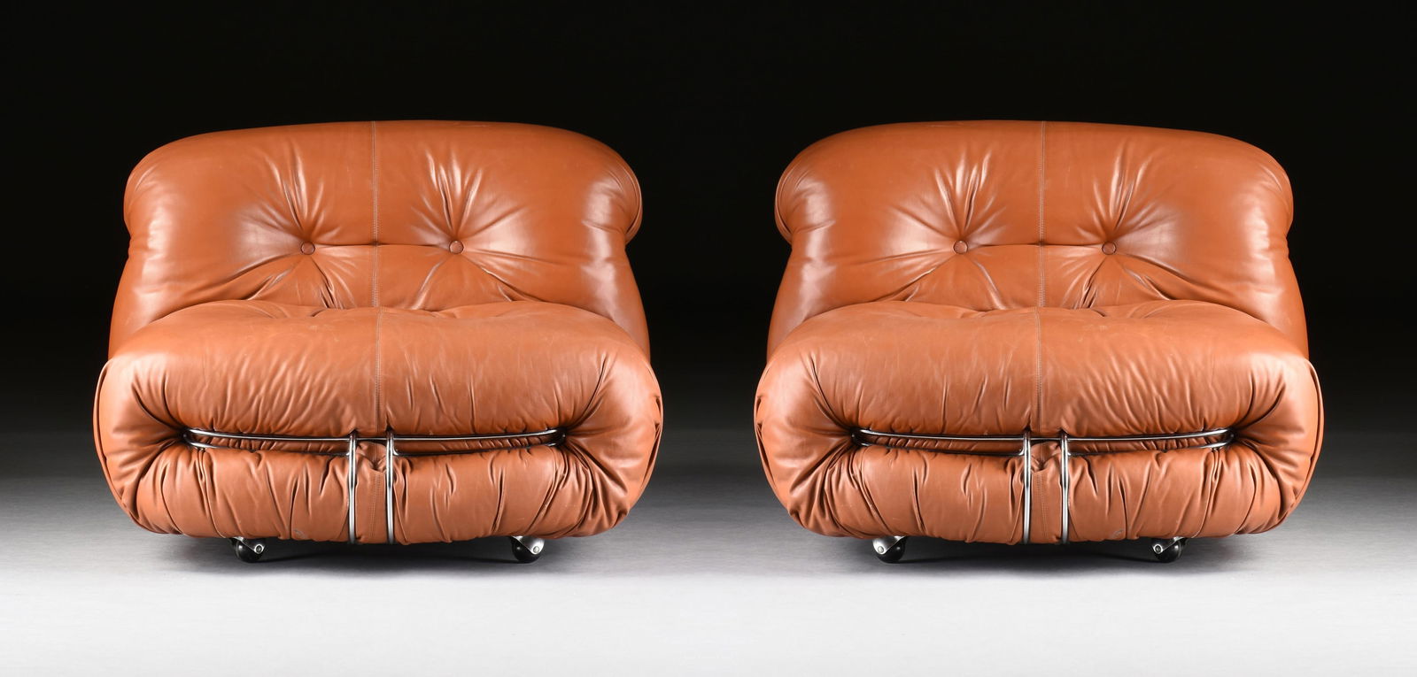 TOBIA SCARPA (Italian b. 1935) A PAIR OF CASSINA "Soriana" LOUNGE CHAIRS, ITALIAN, CIRCA 1970s,: TOBIA SCARPA (Italian b. 1935) A PAIR OF CASSINA "Soriana" LOUNGE CHAIRS, ITALIAN, CIRCA 1970s,two lounge chairs with tufted leather upholstery and chrome plated steel, and with manufacturer labels on