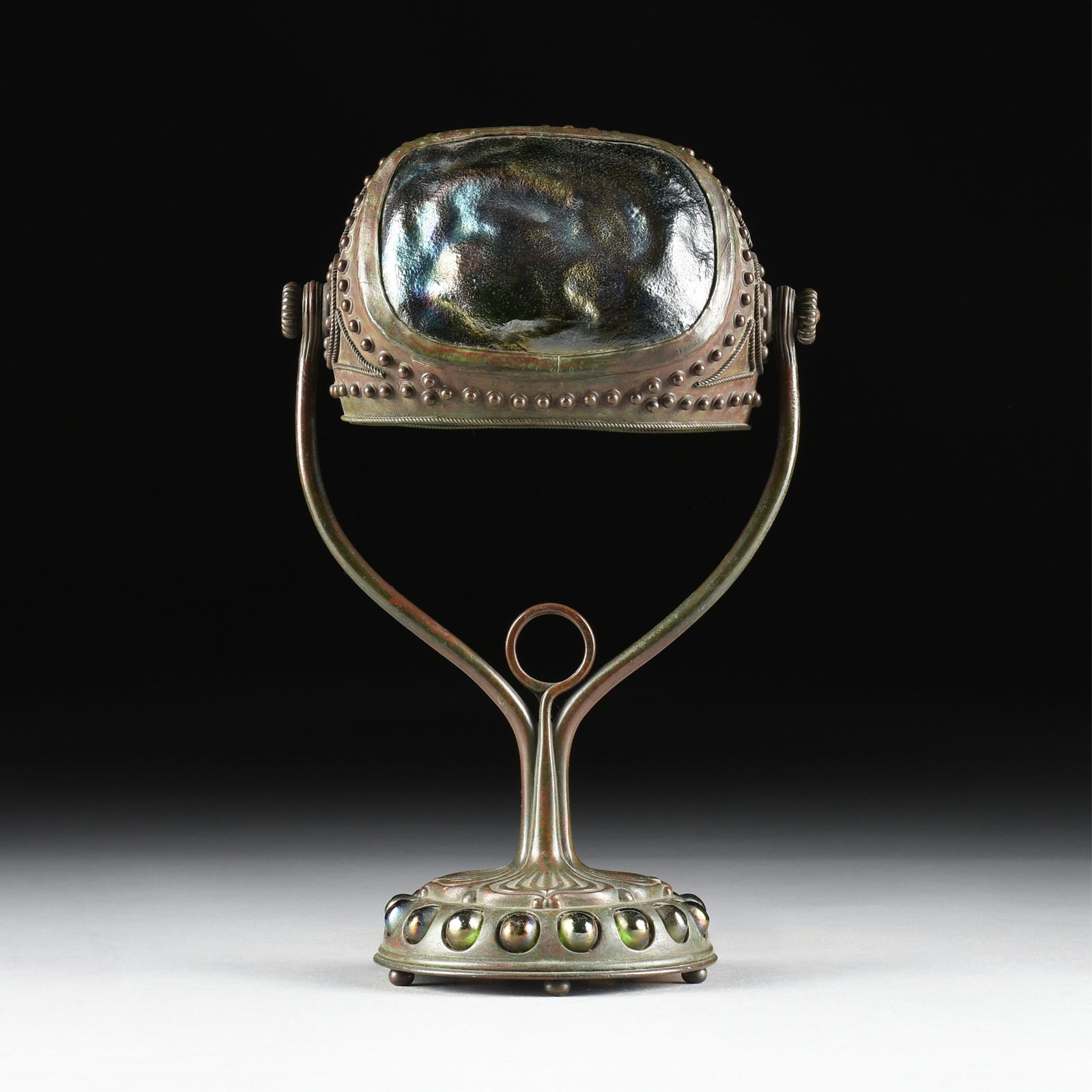 A TIFFANY STUDIOS JEWELED TURTLE-BACK DESK LAMP, AMERICAN, CIRCA 1910,: A TIFFANY STUDIOS JEWELED TURTLE-BACK DESK LAMP, AMERICAN, CIRCA 1910,patinated bronze and favrile glass single socket desk lamp, marked on underside of base, "TIFFANY STUDIOS NEW YORK 408."14 x 9 x 6