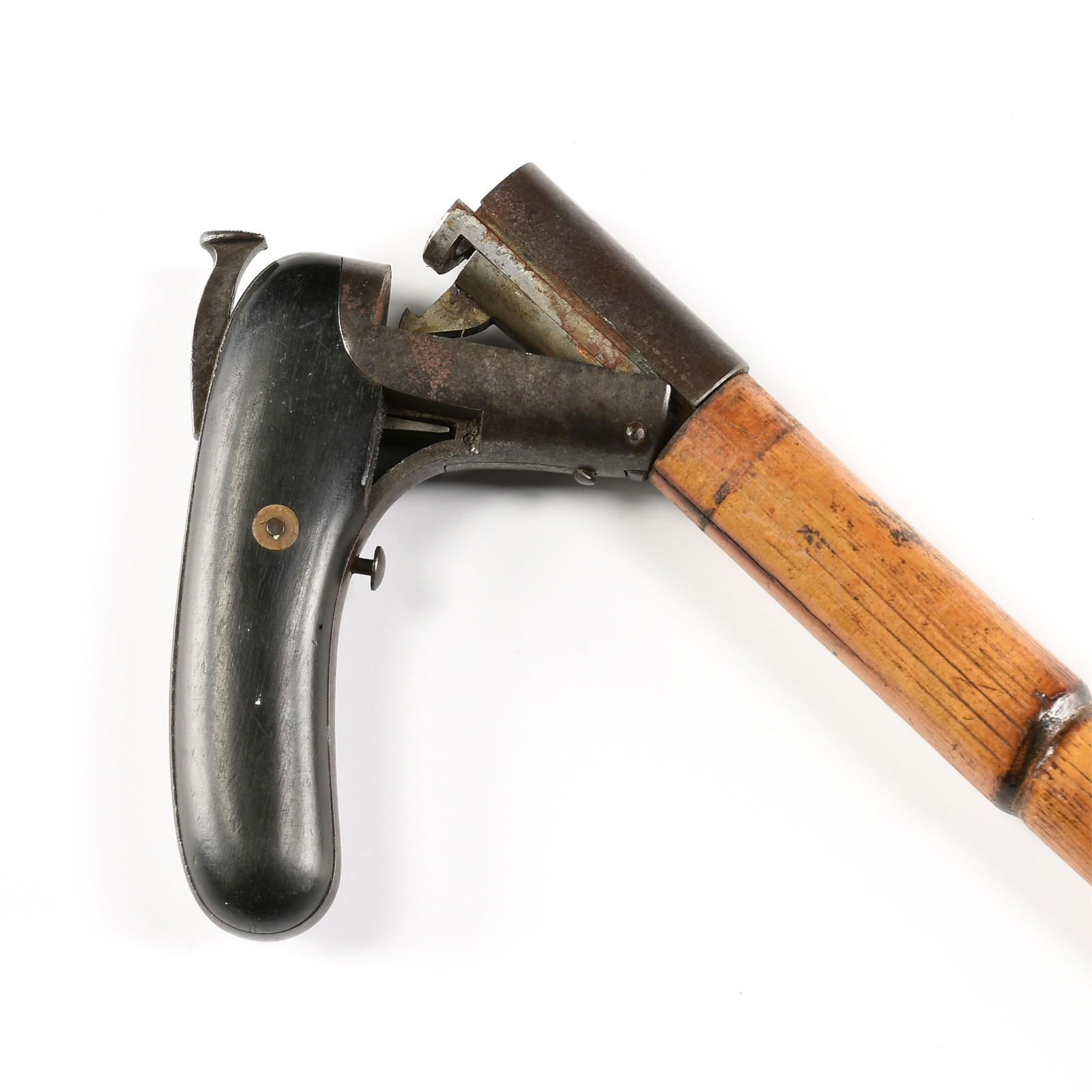 A CANE GUN, 19TH CENTURY,: A CANE GUN, 19TH CENTURY,with sectioned wooden shaft, steel mechanism, blackened wooden grips and removable ferrule at end of barrel, unmarked.Height: 35 in. (88.9 cm.)