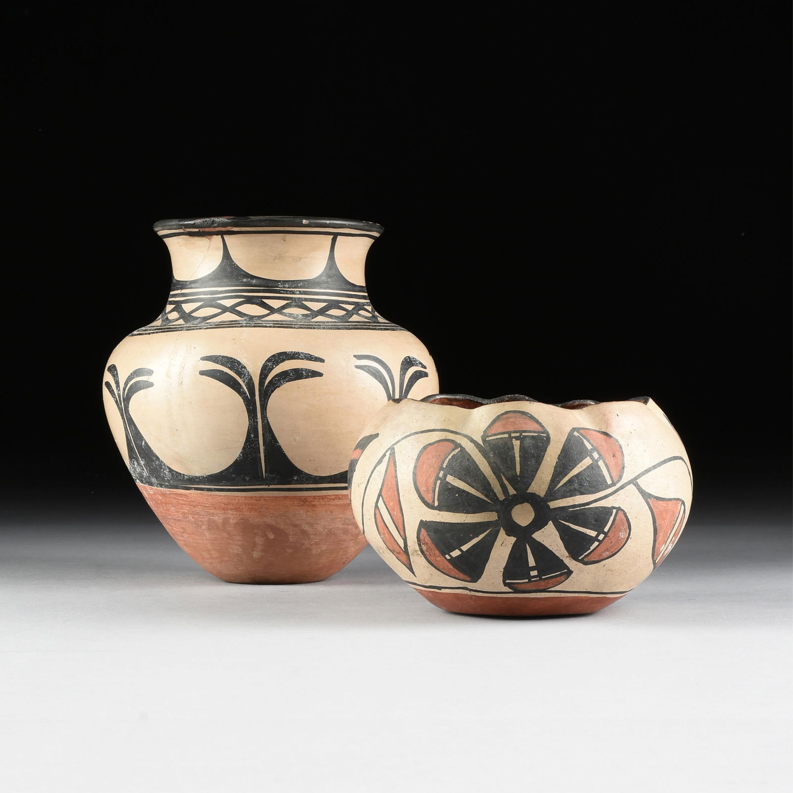A PAIR OF KEWA SANTO DOMINGO VESSELS, NATIVE AMERICAN, 20TH CENTURY,: A PAIR OF KEWA SANTO DOMINGO VESSELS, NATIVE AMERICAN, 20TH CENTURY,hand-painted potteryTallest Height: 9 1/2 in. (24.1 cm.), Shortest Height: 5 1/2 in. (14 cm.) Provenance: Property of a National Ins