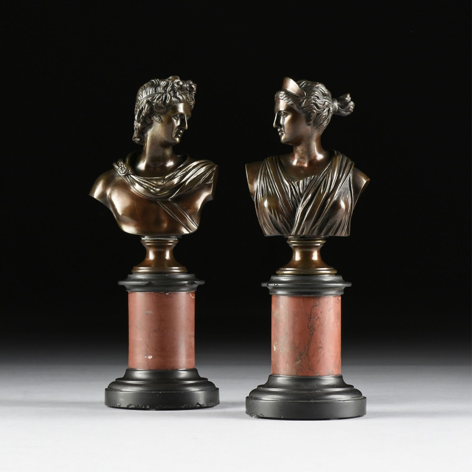 EUROPEAN SCHOOL, A PAIR OF BRONZE BUSTS, "Apollo and Diana," 19TH/20TH CENTURY,: EUROPEAN SCHOOL, A PAIR OF BRONZE BUSTS, "Apollo and Diana," 19TH/20TH CENTURY,a pair of bronze busts on marble and bronze pedestals.Largest: 11 1/2 x 4 3/4 x 4 in. (29.2 x 12.1 x 10.2 cm.)