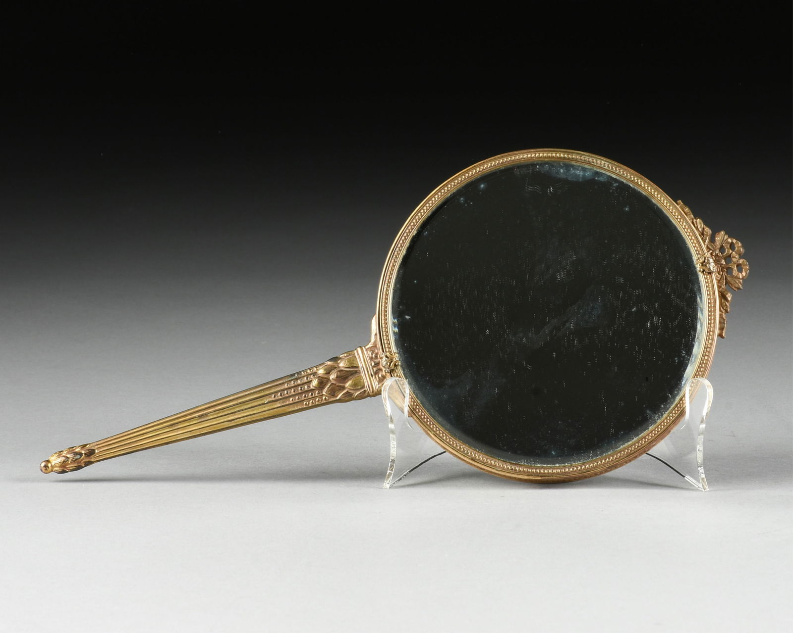 AN APOLLO STUDIOS GILT METAL HAND MIRROR, AMERICAN, EARLY 20TH CENTURY, (1 of 10)