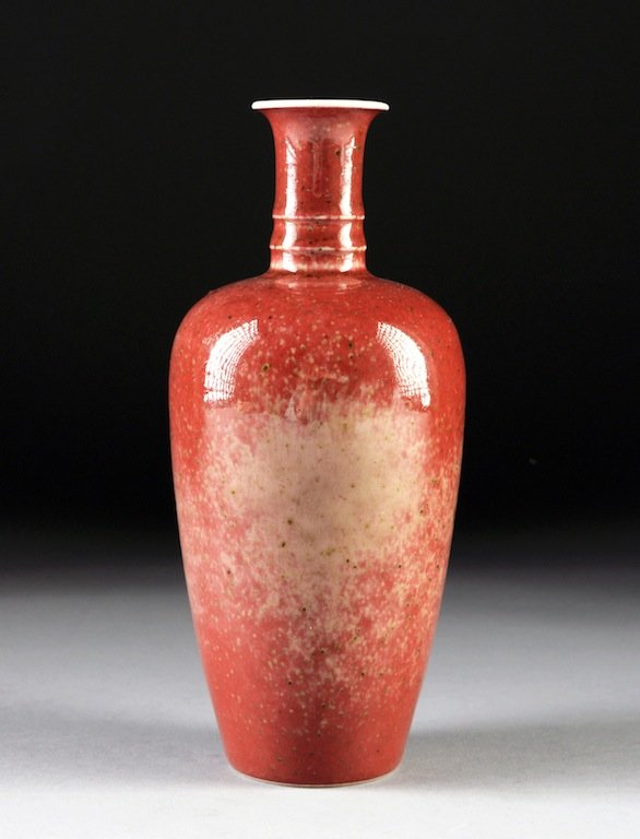 A SMALL CHINESE PEACHBLOOM GLAZED VASE, KANGXI UNDERGLA: A SMALL CHINESE PEACHBLOOM GLAZED VASE, KANGXI UNDERGLAZE BLUE SIX CHARACTER MARKS, POSSIBLY 19TH CENTURY, the flaring white edged rim above an interior shading to white within a double ringed cylindr