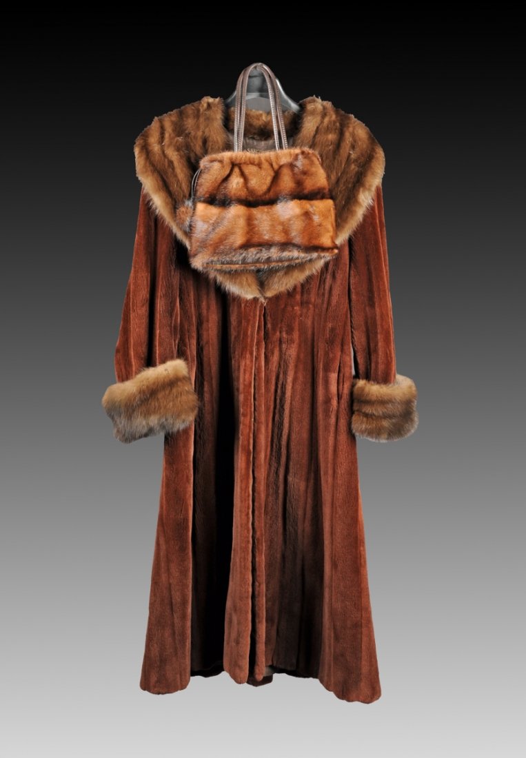 A GIVENCHY BEAVER AND MINK FLOOR LENGTH COAT WITH MATCH: A GIVENCHY BEAVER AND MINK FLOOR LENGTH COAT WITH MATCHING PURSE, sold by Sakowitz, the coat with wide mink opera shawl collar and mink cuffs against a full length beaver fur body, with pockets, appro