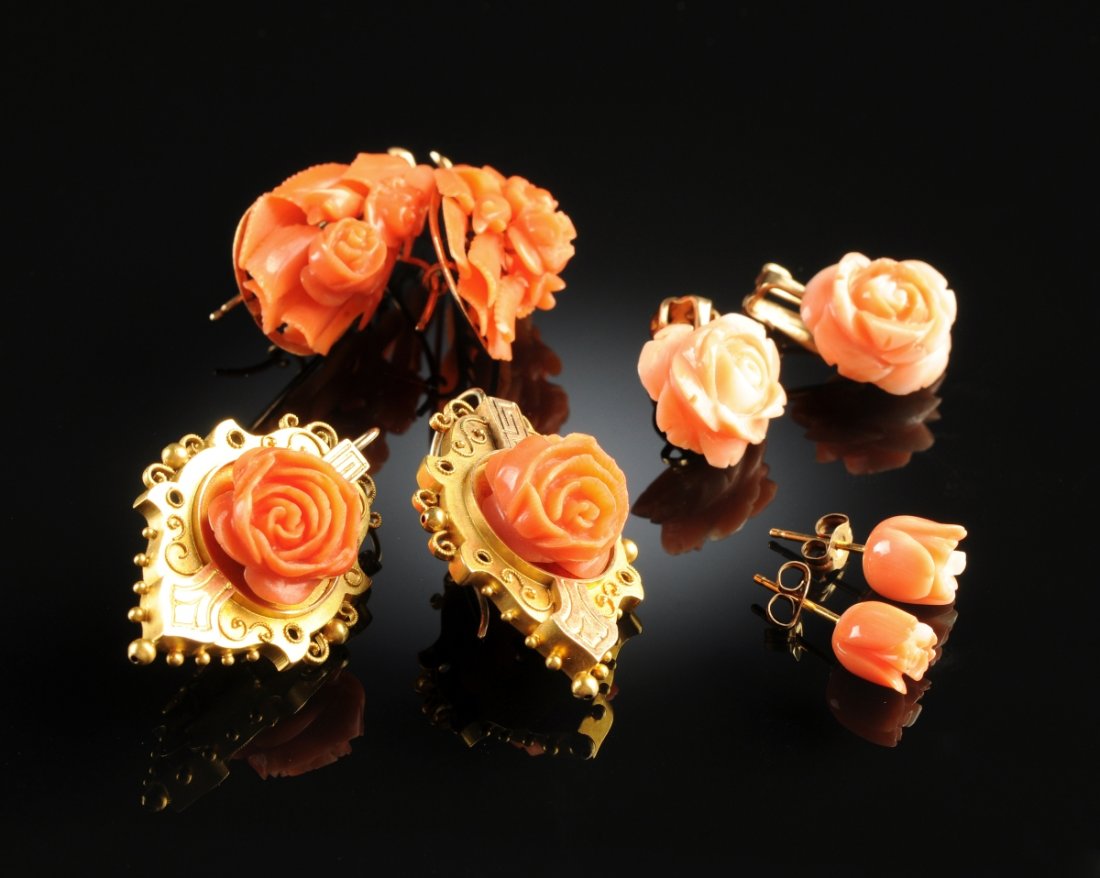 A PINK CORAL LADY'S COLLECTION. Various quality of gold: A PINK CORAL LADY'S COLLECTION. Various quality of gold settings consisting of four pair of earrings, four elaborate floral brooches (two with Cherubs), three pendants (one a shell cameo), one maiden 