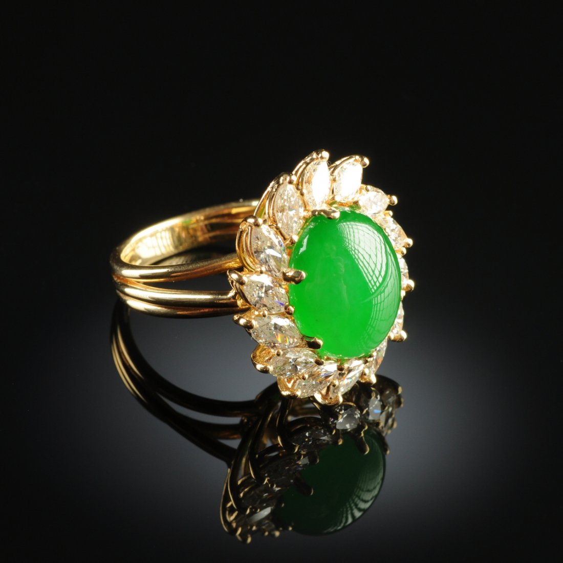 AN 18K GOLD, CHINESE "A" JADEITE JADE, AND DIAMOND LADY: AN 18K GOLD, CHINESE "A" JADEITE JADE, AND DIAMOND LADY'S RING, handmade wire mounting in yellow gold setting with natural, type "A" jadeite jade oval measuring approximately 11.0 x 13.4 x 7.0 millime