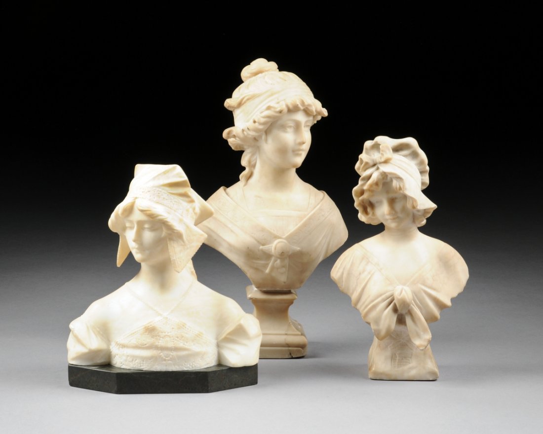 THREE CARVED ALABASTER BUSTS OF MAIDENS, the first of : THREE CARVED ALABASTER BUSTS OF MAIDENS, the first of a young maiden with ribbon tied bonnet, on carved pedestal, artist signed to verso, height: 14"; a young lady with sash tied to hair and wearing a