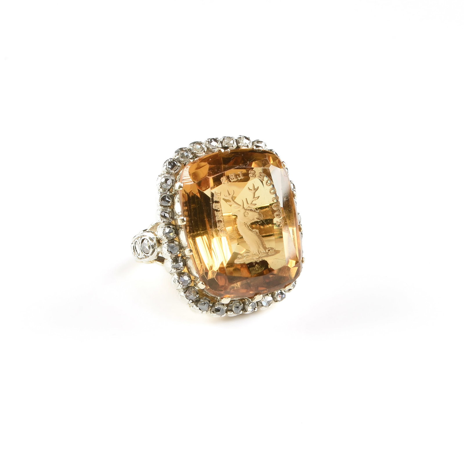 A 14K GOLD, CITRINE, AND DIAMOND INTAGLIO RING,: A 14K GOLD, CITRINE, AND DIAMOND INTAGLIO RING, 14k yellow gold ring set with a large central citrine (19 x 15.5 mm) engraved with a seal depicting the head of a deer and the phrase, "Toujours Les