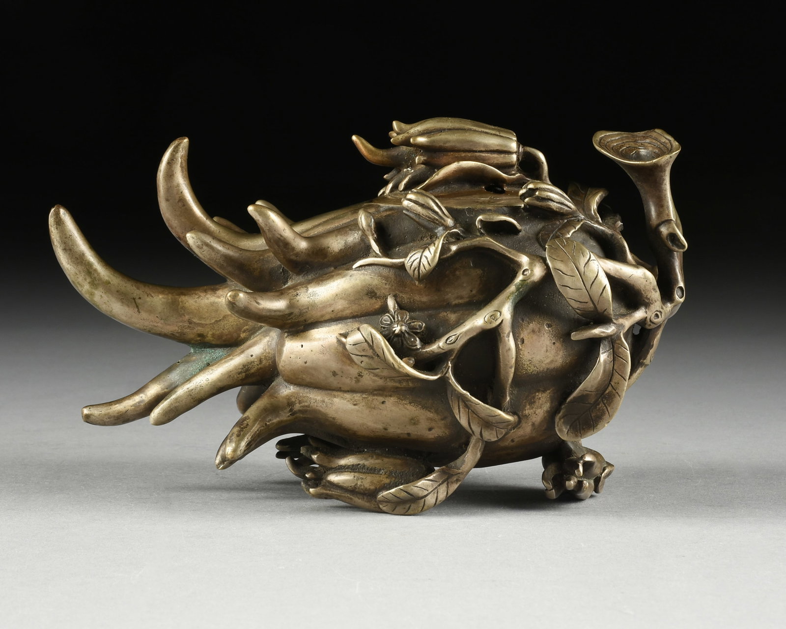 A BUDDHA'S HAND CENSER, CHINESE, 19TH/20TH CENTURY,: A BUDDHA'S HAND CENSER, CHINESE, 19TH/20TH CENTURY, a patinated bronze incense burner, and with seal on underside. 5 x 9 x 5 in. (12.7 x 22.9 x 12.7 cm.) Provenance: Private Collection, Houston,