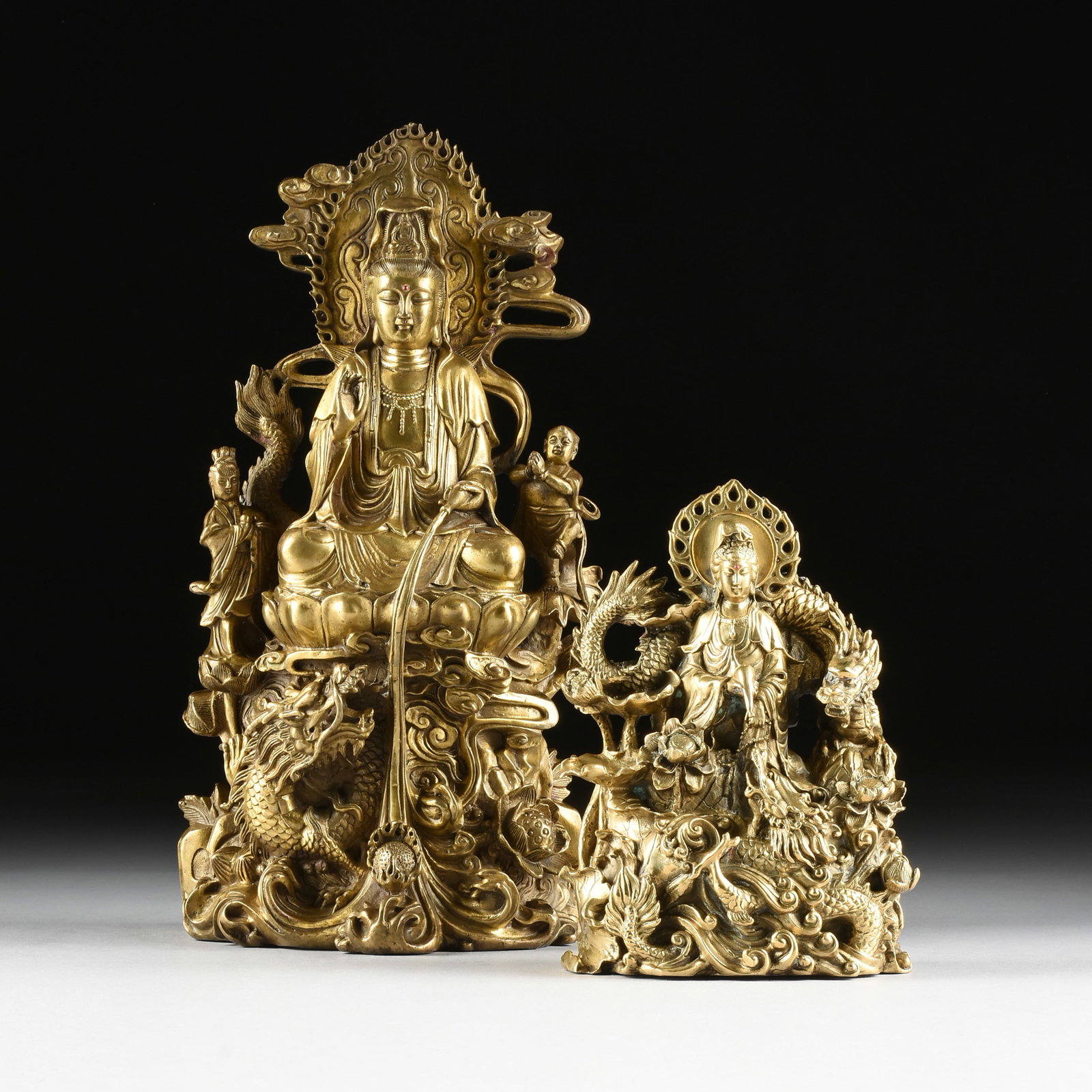 TWO BUDDHIST SCULPTURES, 20TH CENTURY,: TWO BUDDHIST SCULPTURES, 20TH CENTURY, cast brass. Largest: 16 1/2 x 9 x 6 in. (41.9 x 22.9 x 15.2 cm.) Provenance: Private Collection, Houston, Texas.