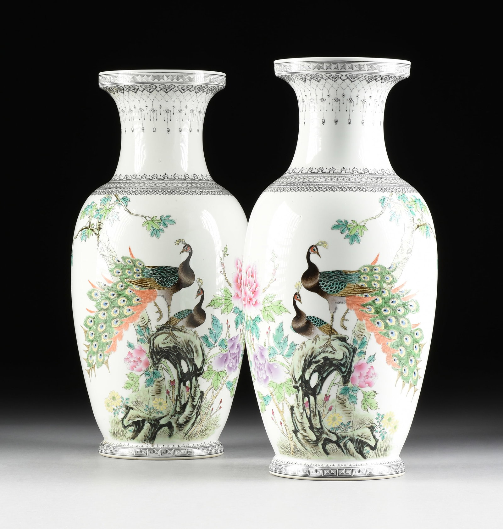 A PAIR OF PORCELAIN PEACOCK VASES, CHINESE, MID 20TH CENTURY,: A PAIR OF PORCELAIN PEACOCK VASES, CHINESE, MID 20TH CENTURY, two hand painted white porcelain baluster form vases decorated with peacocks, and with a poem on the reverse. Each: 18 x 8 1/2 x 8 1/2 in.
