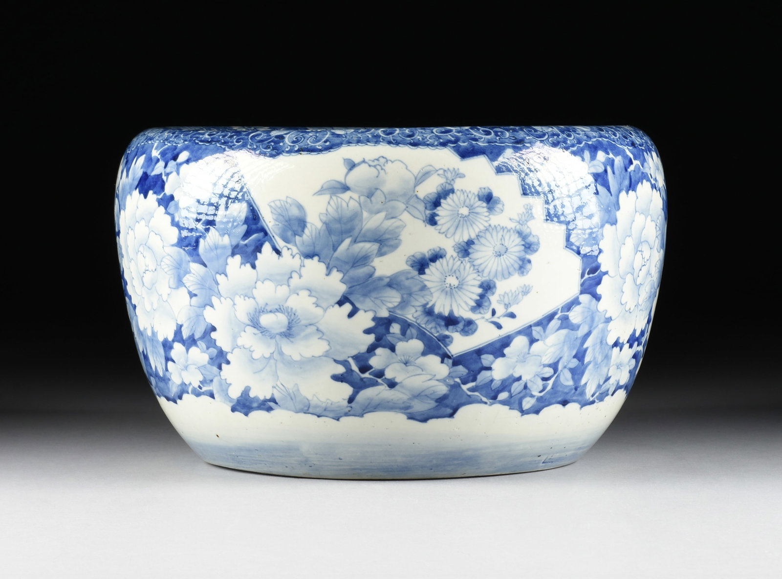 A BLUE AND WHITE PLANTER, JAPANESE, EARLY 20TH CENTURY,: A BLUE AND WHITE PLANTER, JAPANESE, EARLY 20TH CENTURY, hand-painted porcelain planter. 11 x 18 in. (27.9 x 45.7 cm.) Provenance: Private Collection, Houston, Texas.