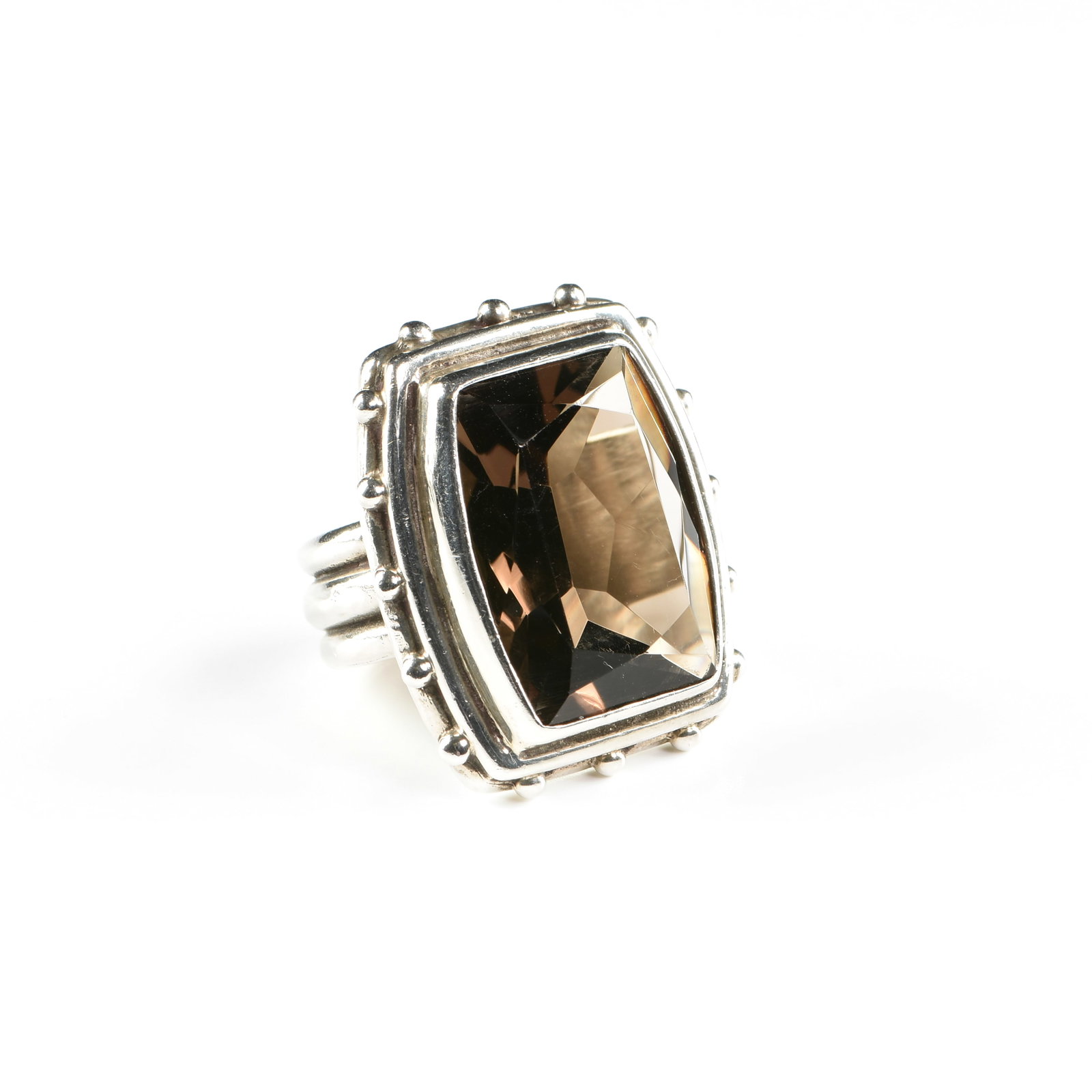 A 10K GOLD AND SMOKY TOPAZ RING,: A 10K GOLD AND SMOKY TOPAZ RING, 10k white gold ring with a bezel set smoky topaz (20 x 15 mm). Ring size: 5. Total approximate weight: 18.1 grams. Provenance: Private Collection, Houston, Texas.