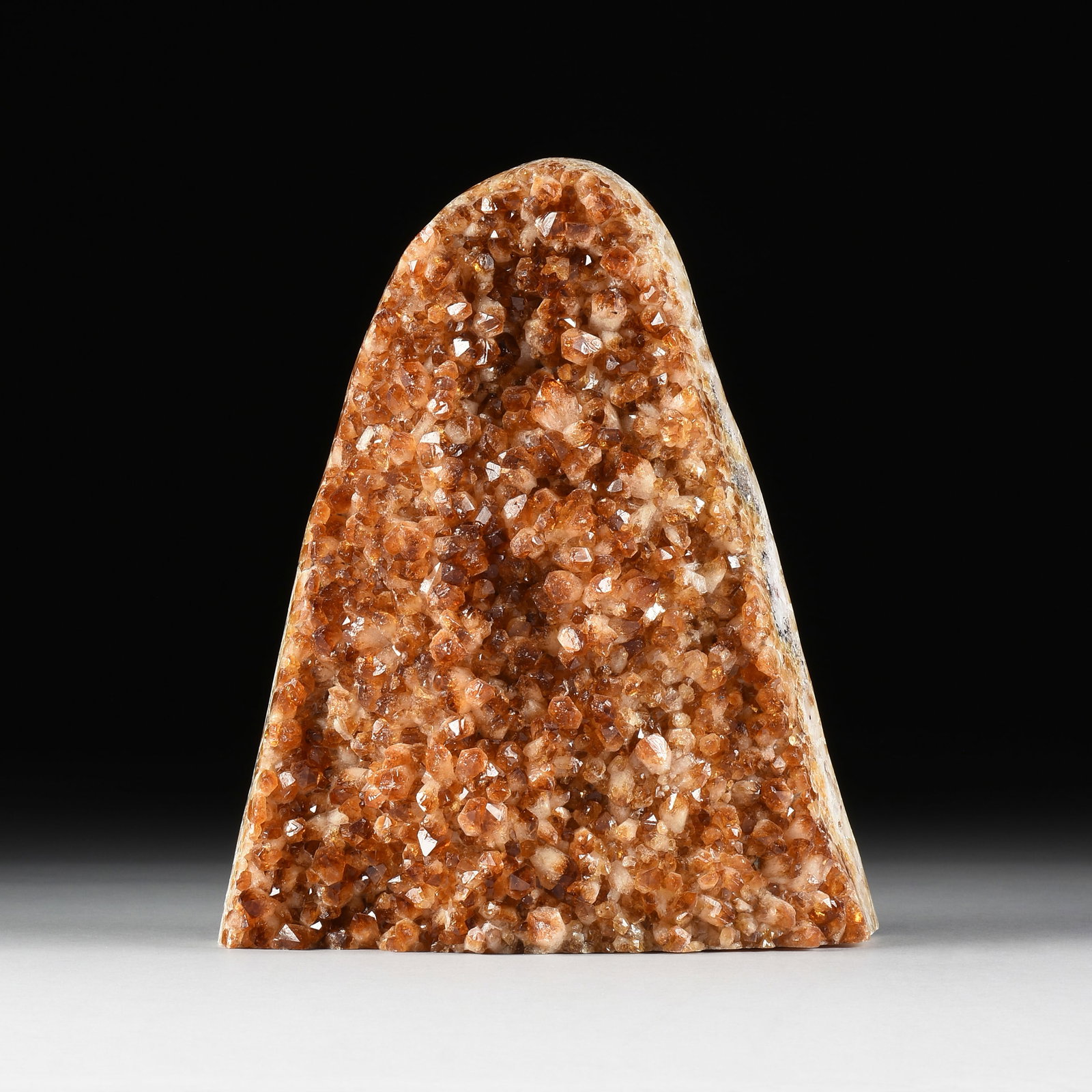 A CITRINE CLUSTER SPECIMEN, BRAZIL,: A CITRINE CLUSTER SPECIMEN, BRAZIL, polished and heat treated amethyst specimen. Total approximate weight: 27 lbs. 13 x 10 1/2 x 4 in. (33 x 26.7 x 10.2 cm.) Provenance: Private Collection, Houston, T