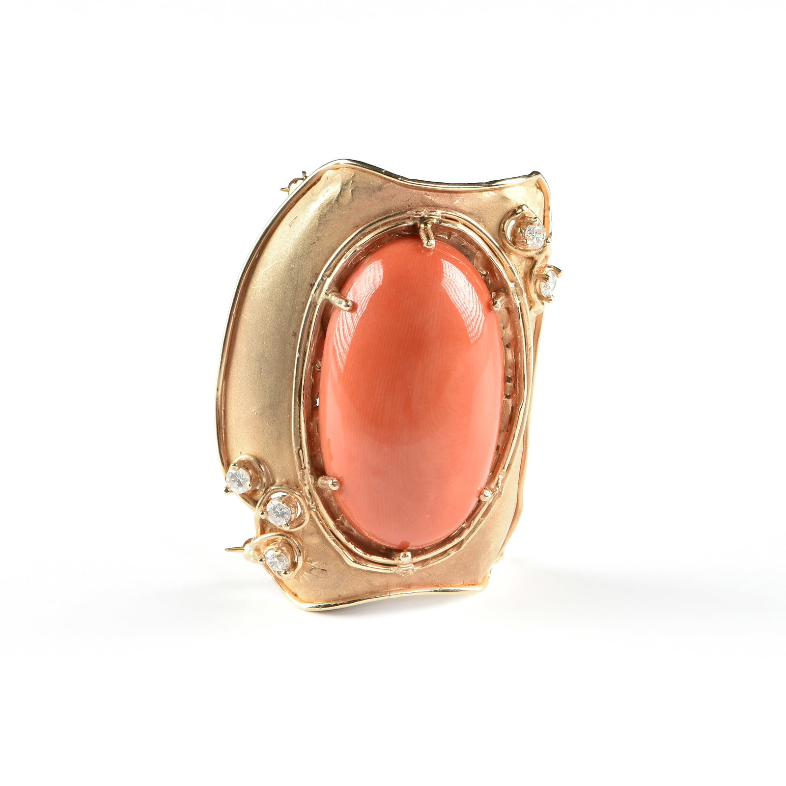 A LOIS LADIN 14K GOLD, CORAL, AND DIAMOND BROOCH, AMERICAN, 1990,: A LOIS LADIN 14K GOLD, CORAL, AND DIAMOND BROOCH, AMERICAN, 1990, 14k gold set with a large coral cabochon and five round accent diamonds (approx. 2.0 - 2.5 mm each), and with double locking c-clasps 