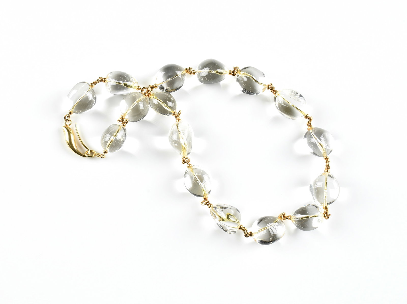 AN 18K GOLD AND ROCK CRYSTAL NECKLACE, (1 of 2)