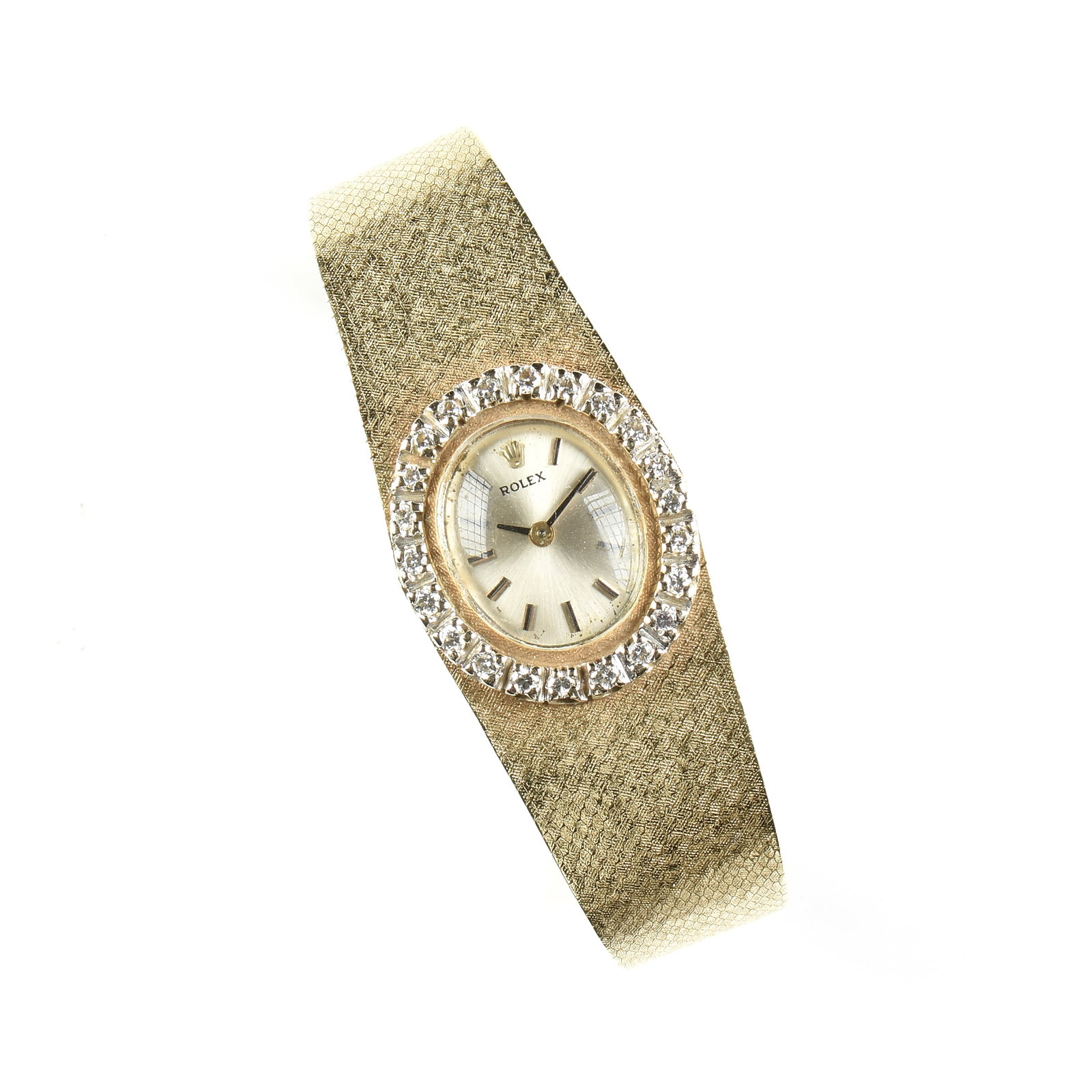 A ROLEX 14K GOLD AND DIAMOND WATCH, SWISS, 20TH CENTURY,: A ROLEX 14K GOLD AND DIAMOND WATCH, SWISS, 20TH CENTURY, 14k yellow gold bracelet watch with silvered dial surrounded by a halo of twenty-two round cut accent diamonds (approx. 1.5 - 1.7 mm each), wit
