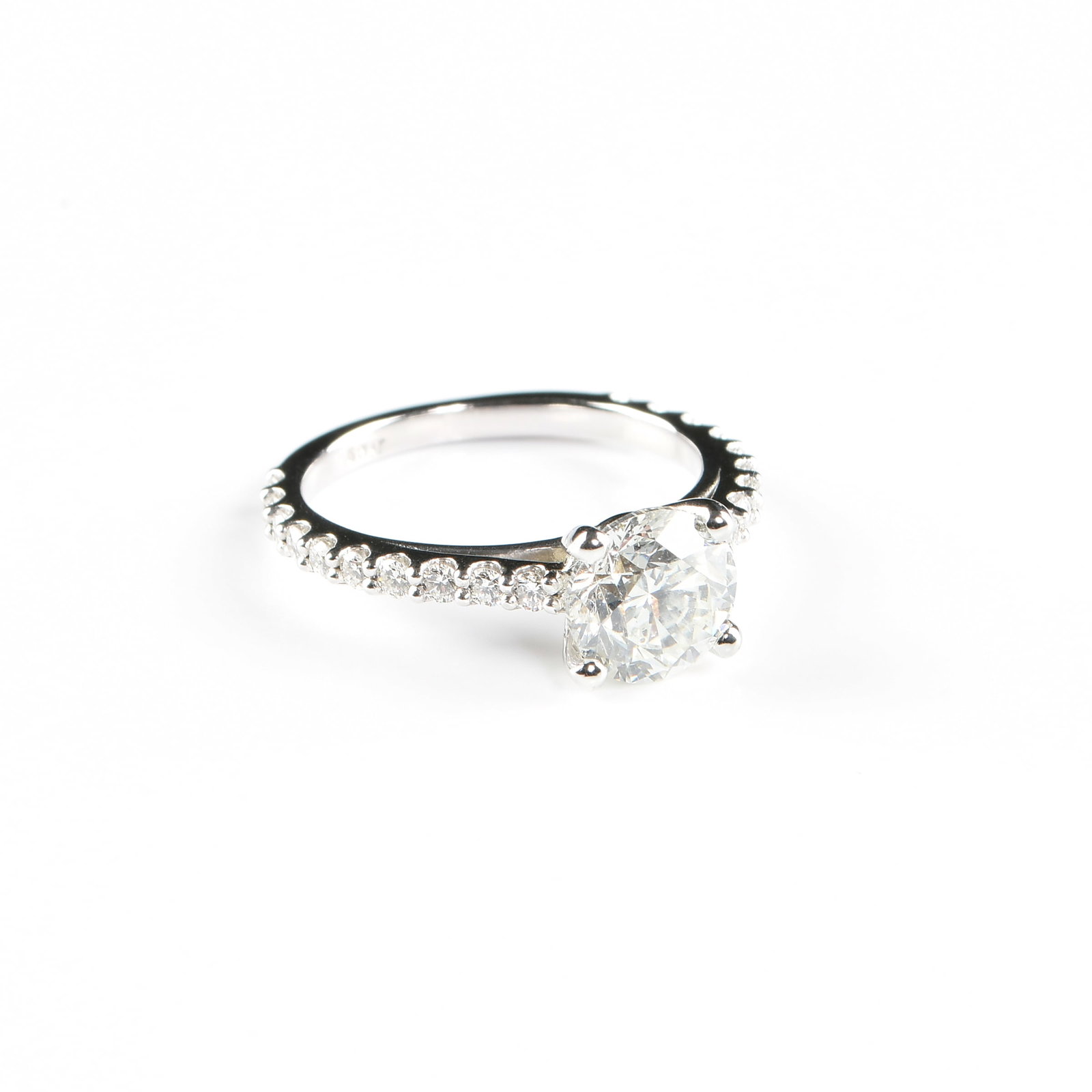 A PLATINUM AND ROUND DIAMOND RING,: A PLATINUM AND ROUND DIAMOND RING, platinum ring set with a 1.5 carat round brilliant cut diamond (I, SI2) on a four prong setting, and the band accented with melee diamonds totaling approximately 0.4