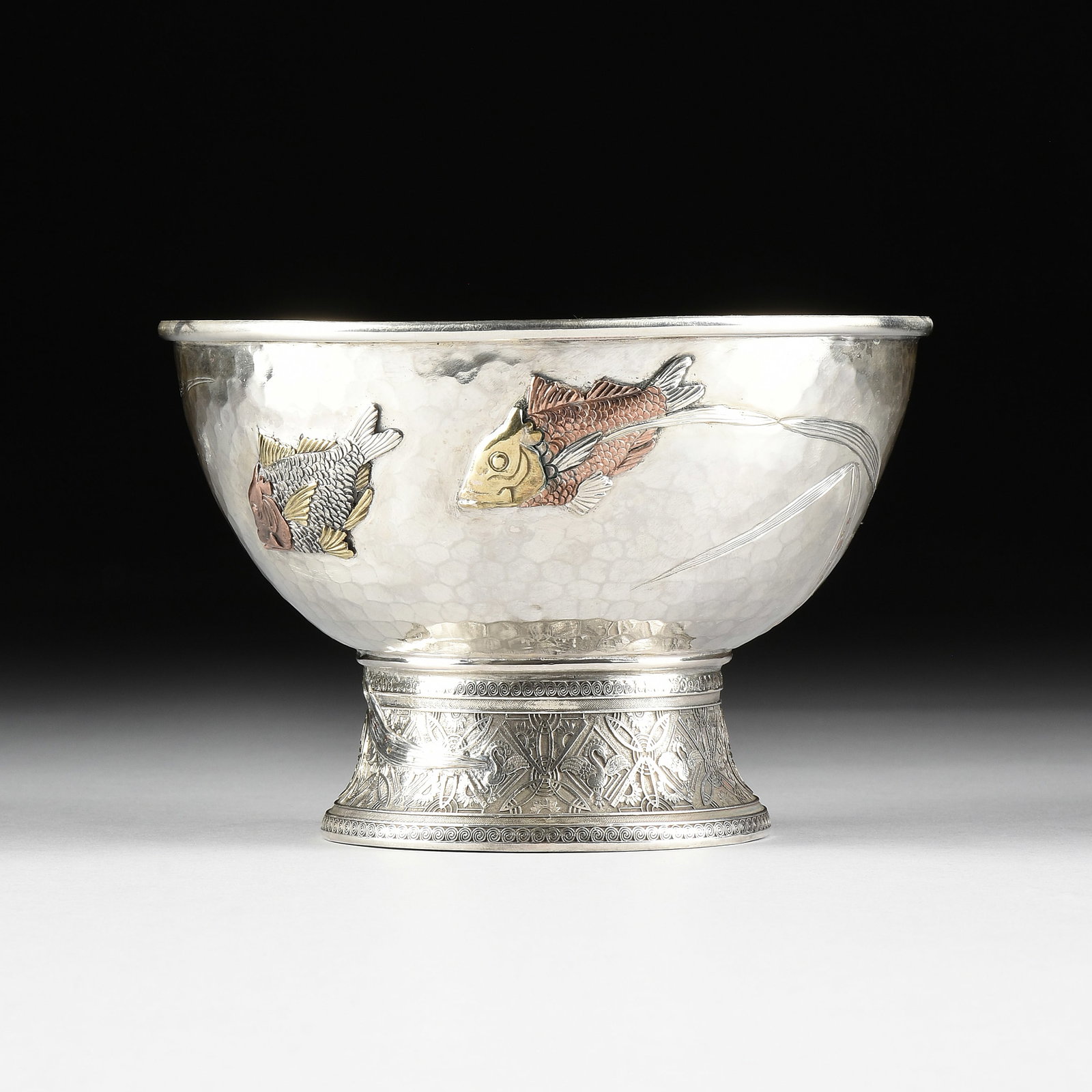 A TIFFANY & CO. STERLING SILVER AND MIXED METAL ICE BOWL, AMERICAN, LATE 19TH CENTURY, DESIGNED: A TIFFANY & CO. STERLING SILVER AND MIXED METAL ICE BOWL, AMERICAN, LATE 19TH CENTURY, DESIGNED 1877, a sterling silver footed bowl with hammered finish and mixed metal ornament in the Japanese